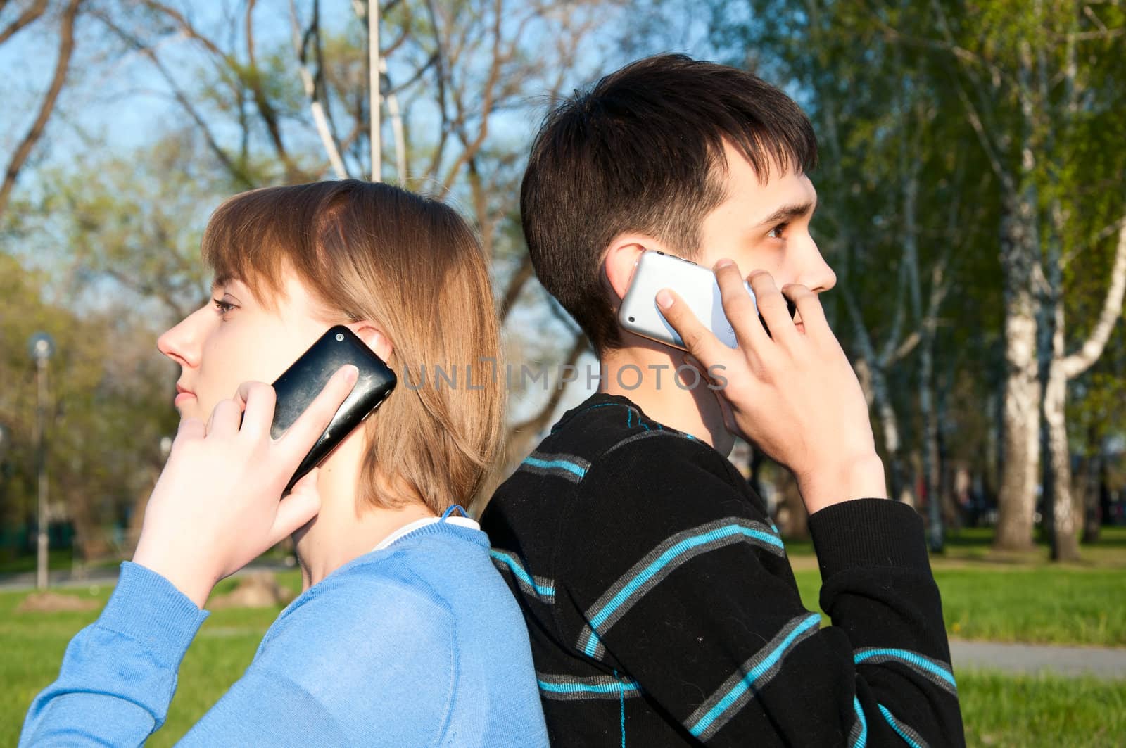 boy and girl talking with a cell