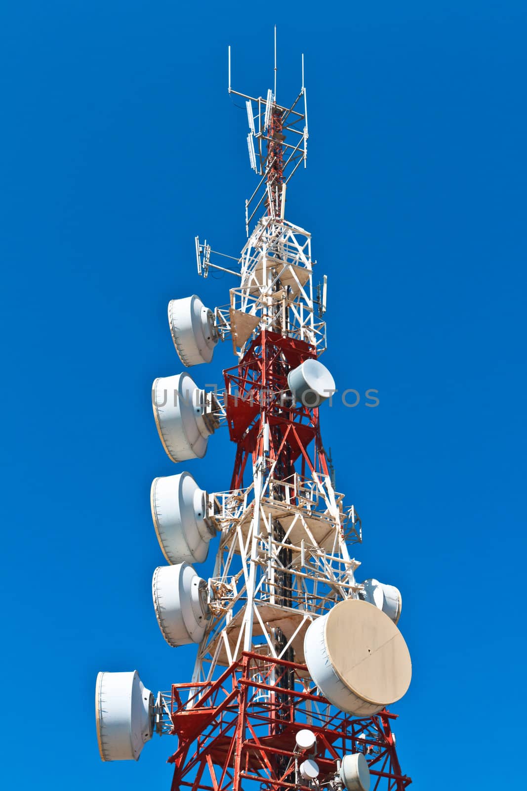 Communications tower with a beautiful blue sky
