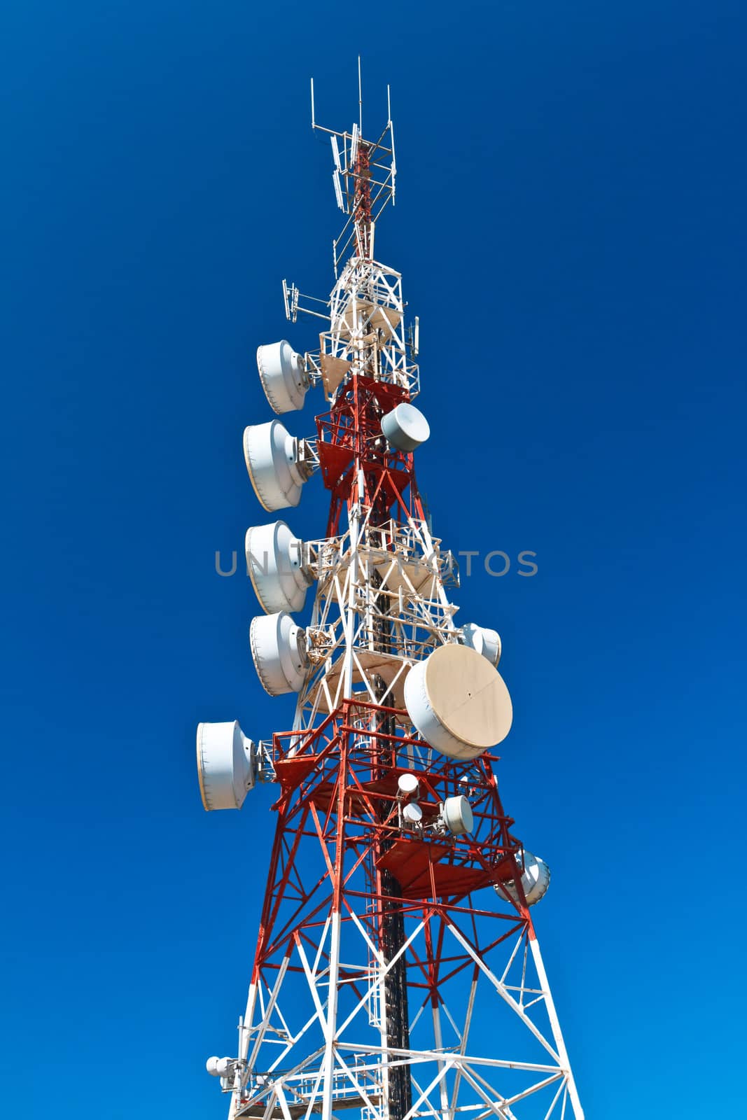 Communications tower with a beautiful blue sky