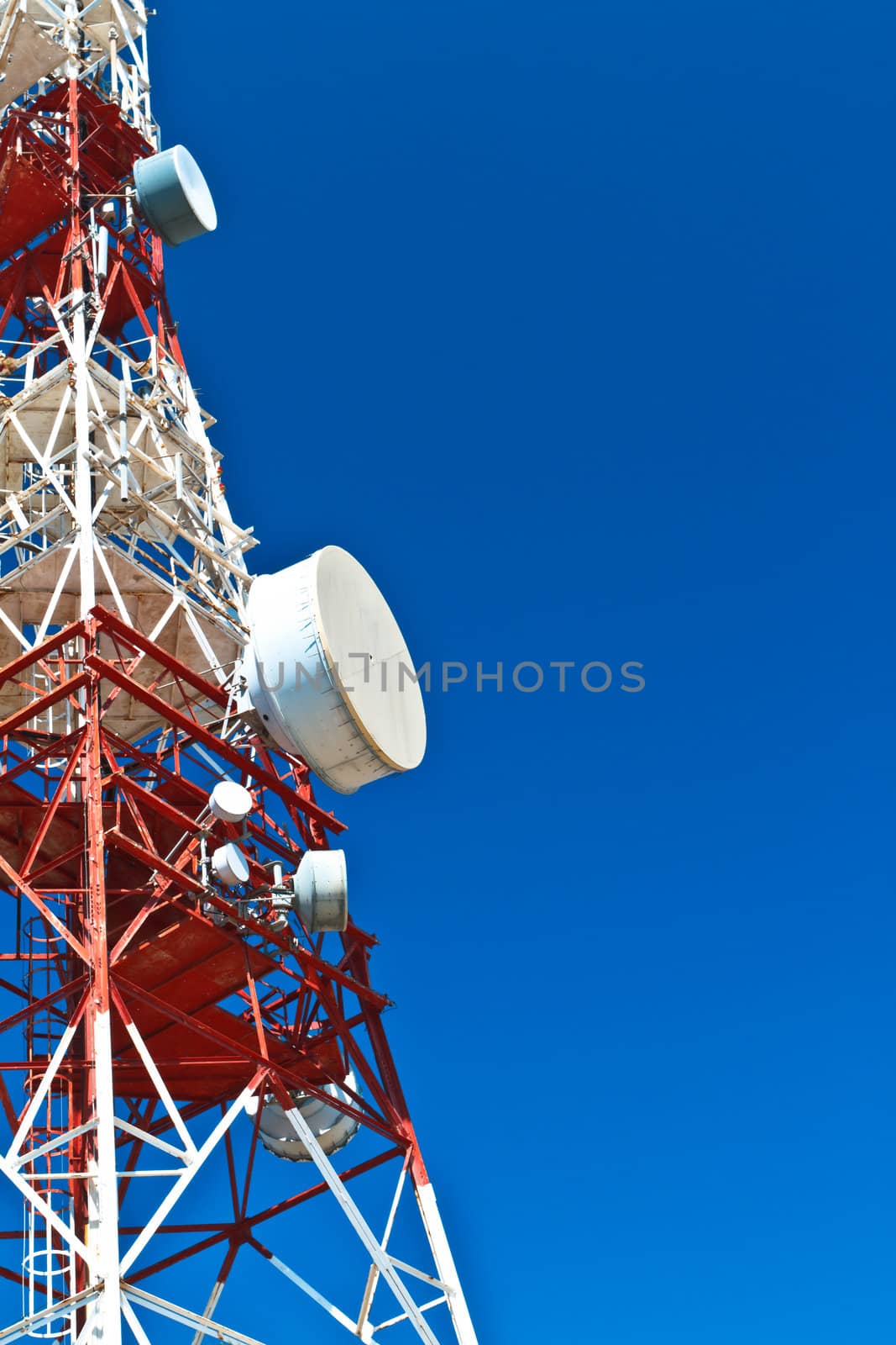 Communications tower with a beautiful blue sky