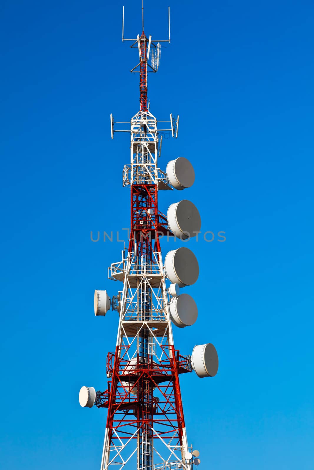 Communications tower with a beautiful blue sky