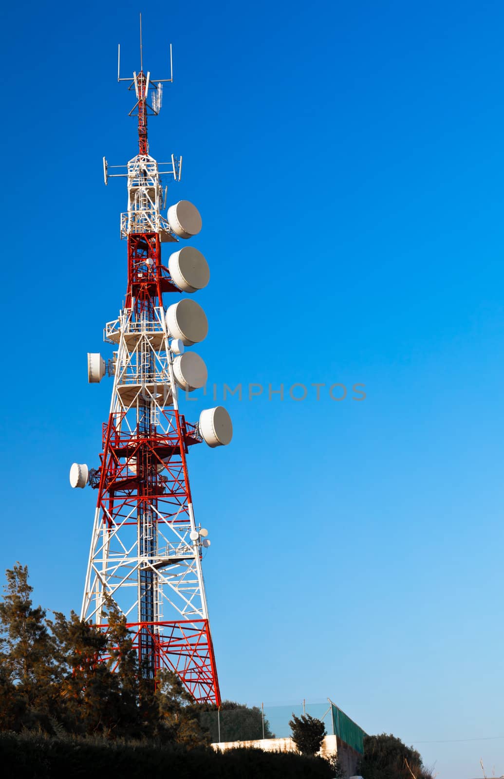 Communications tower with a beautiful blue sky