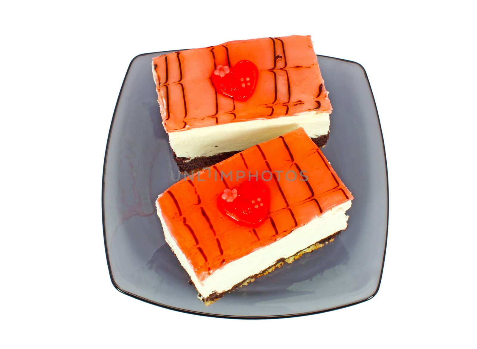 Homemade cakes with red heart on glass plate, isolated on white