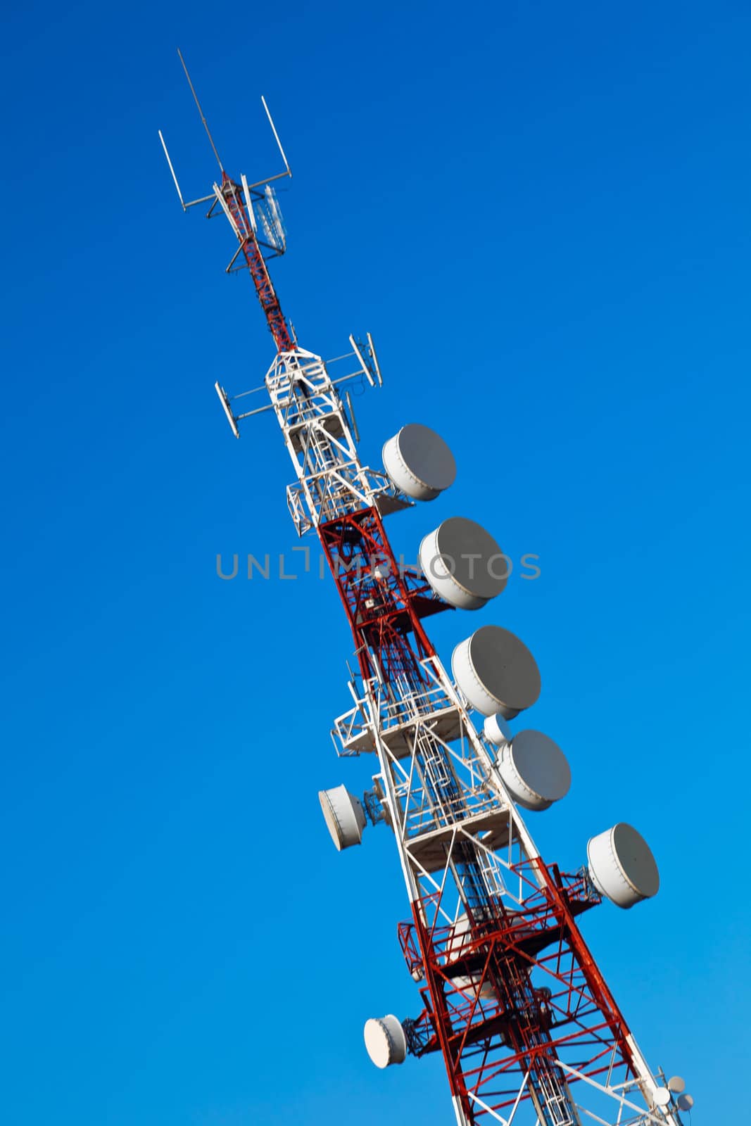 Communications tower with a beautiful blue sky
