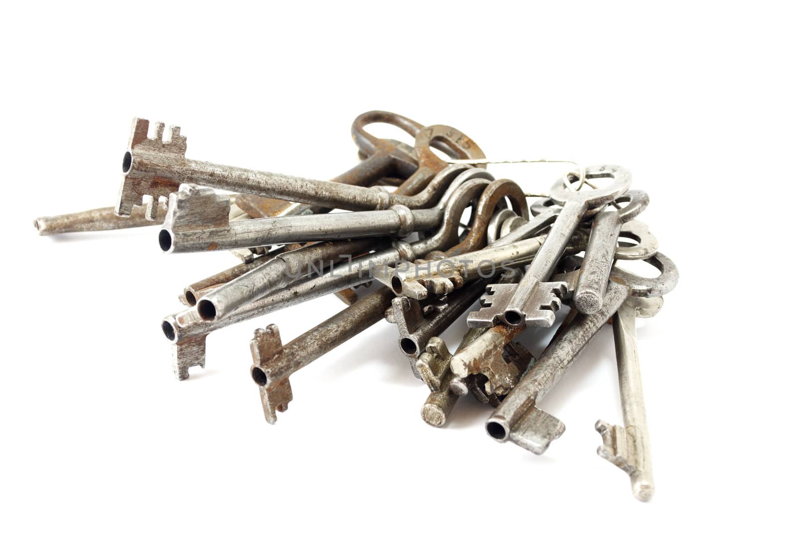 large bunch  of old keys on a white background