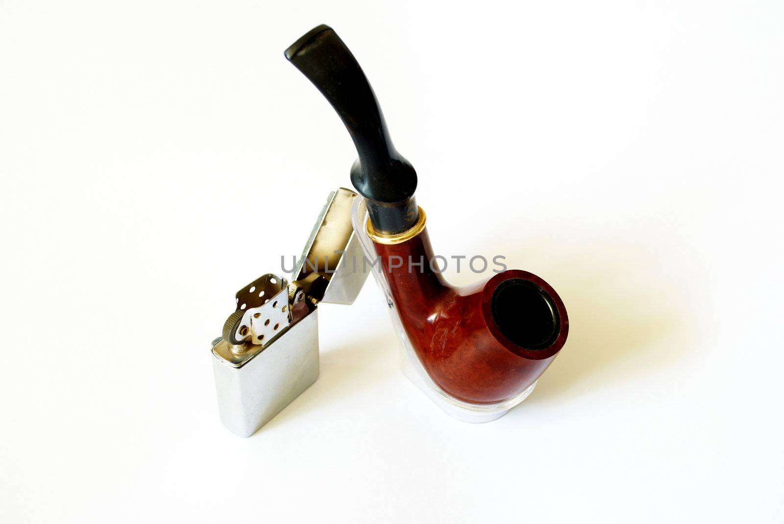 tobacco pipe and petrol lighter with a white background