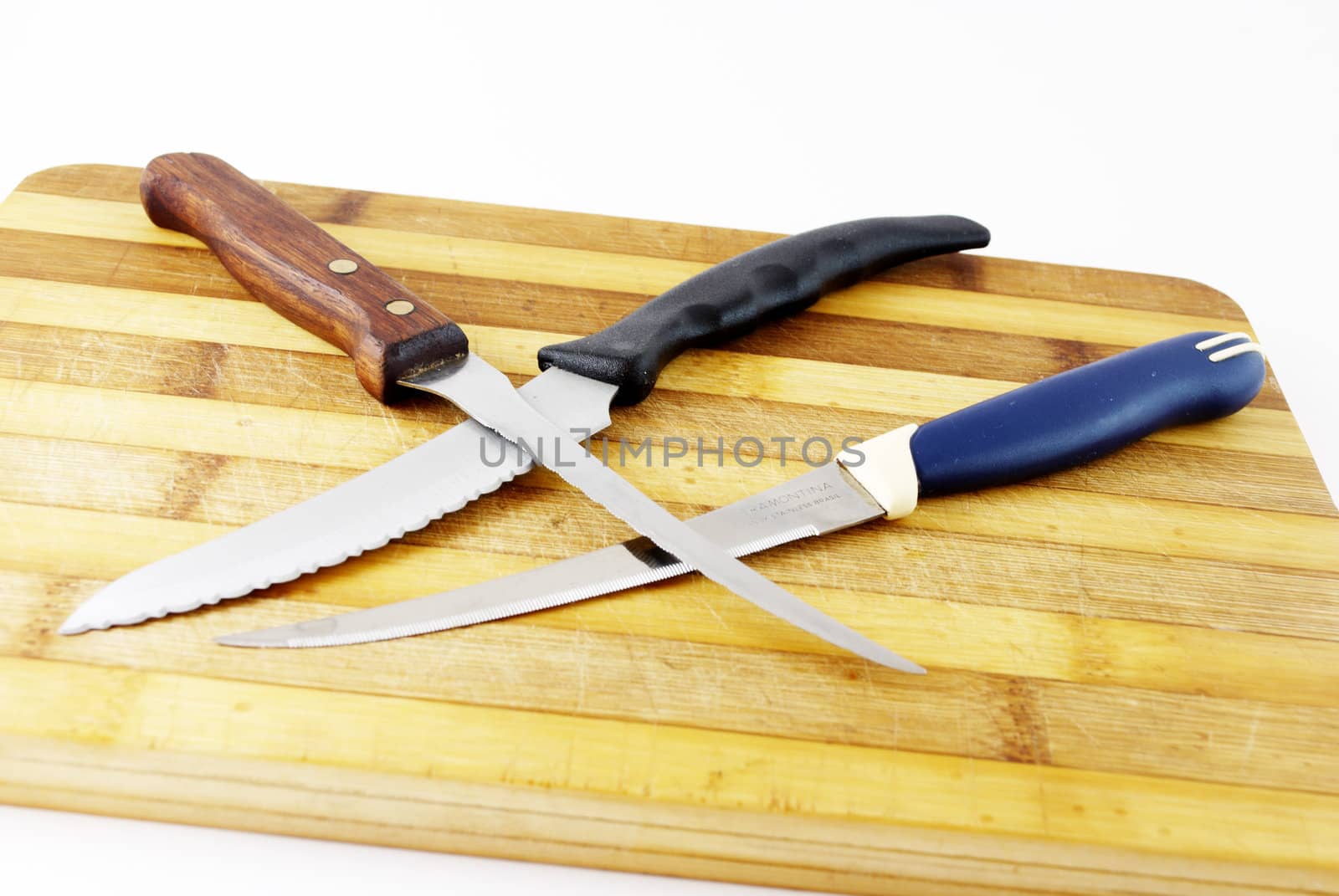 kitchen knives and cutting board on a white background