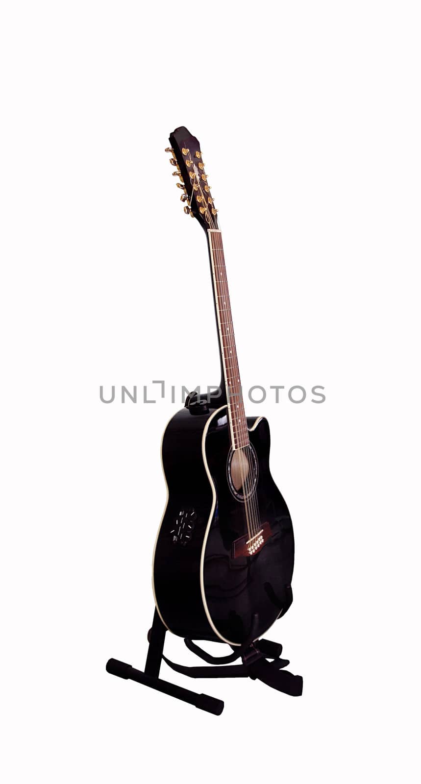 Black guitar on a stand on the white background
