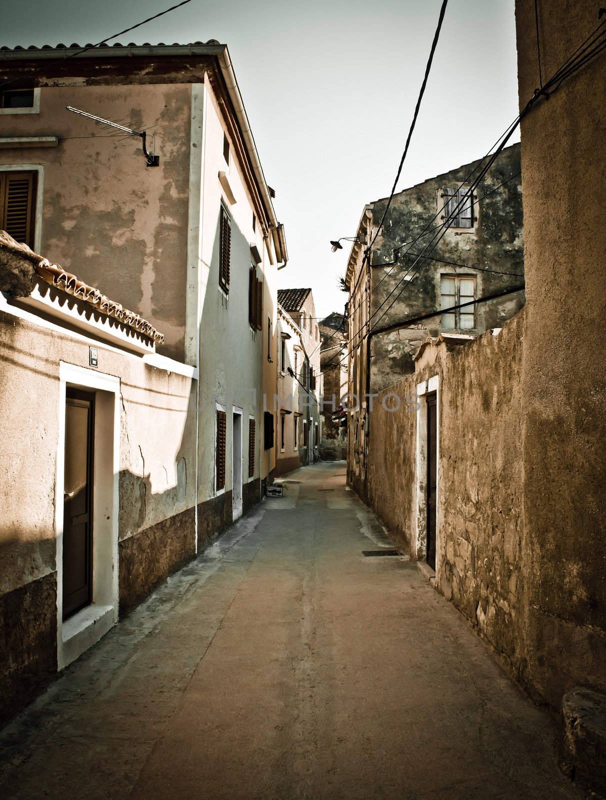 Narrow mediterranean street in Dalmatia by xbrchx