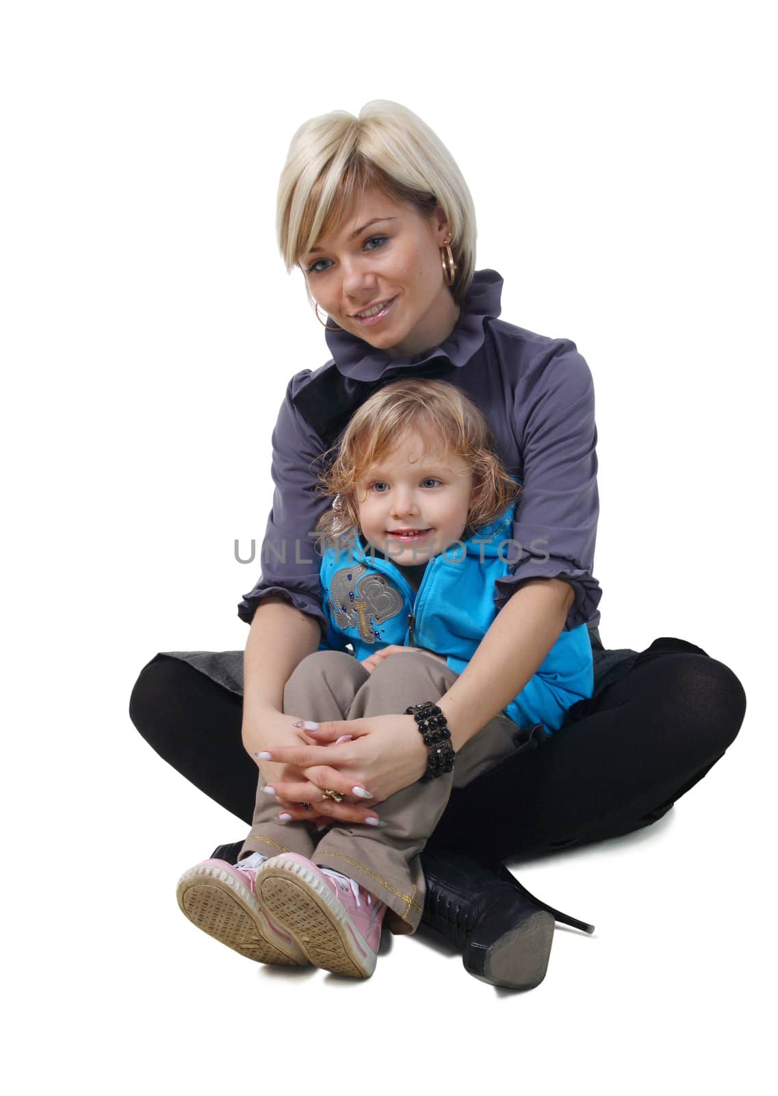 little girl hugs the young mother on the white background
