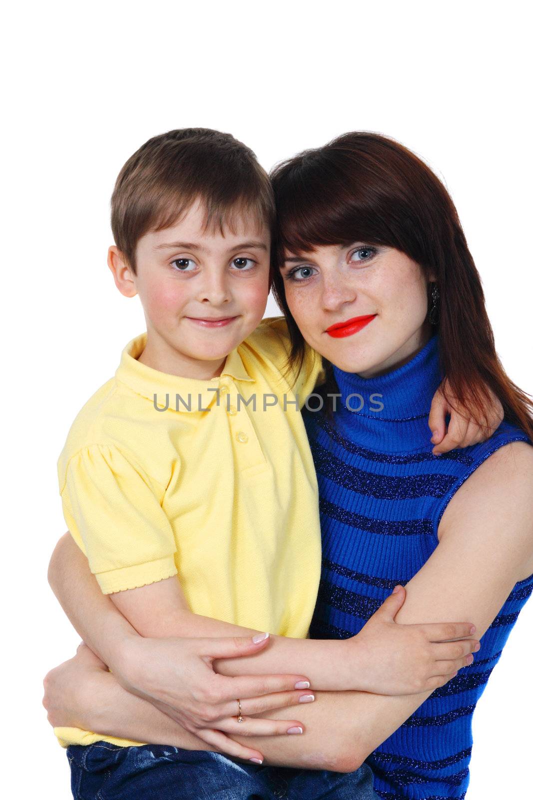 little boy hugs a young beautiful girl on the white background
