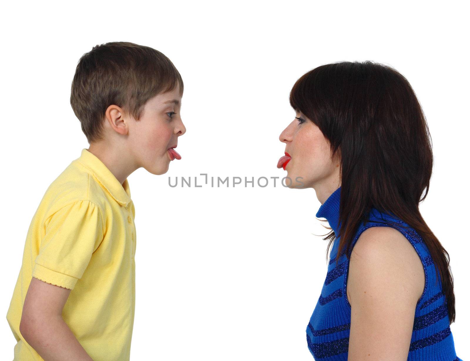 little boy and young woman put out each other tongues on the white background
