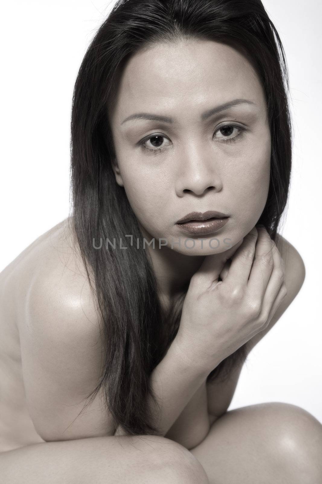 Studio portrait of a asian girl looking sad