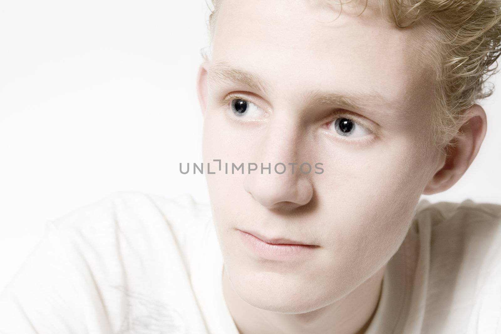 Portrait of a young man in the studio looking pensive