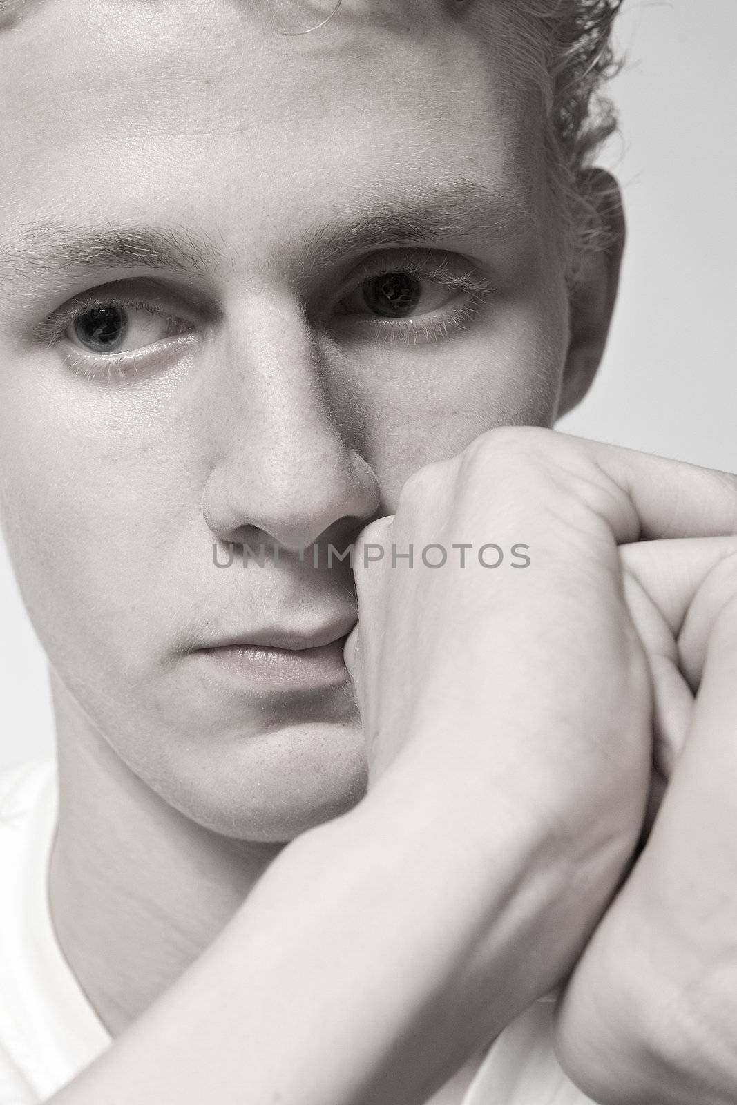 Sad young man in thoughts by DNFStyle
