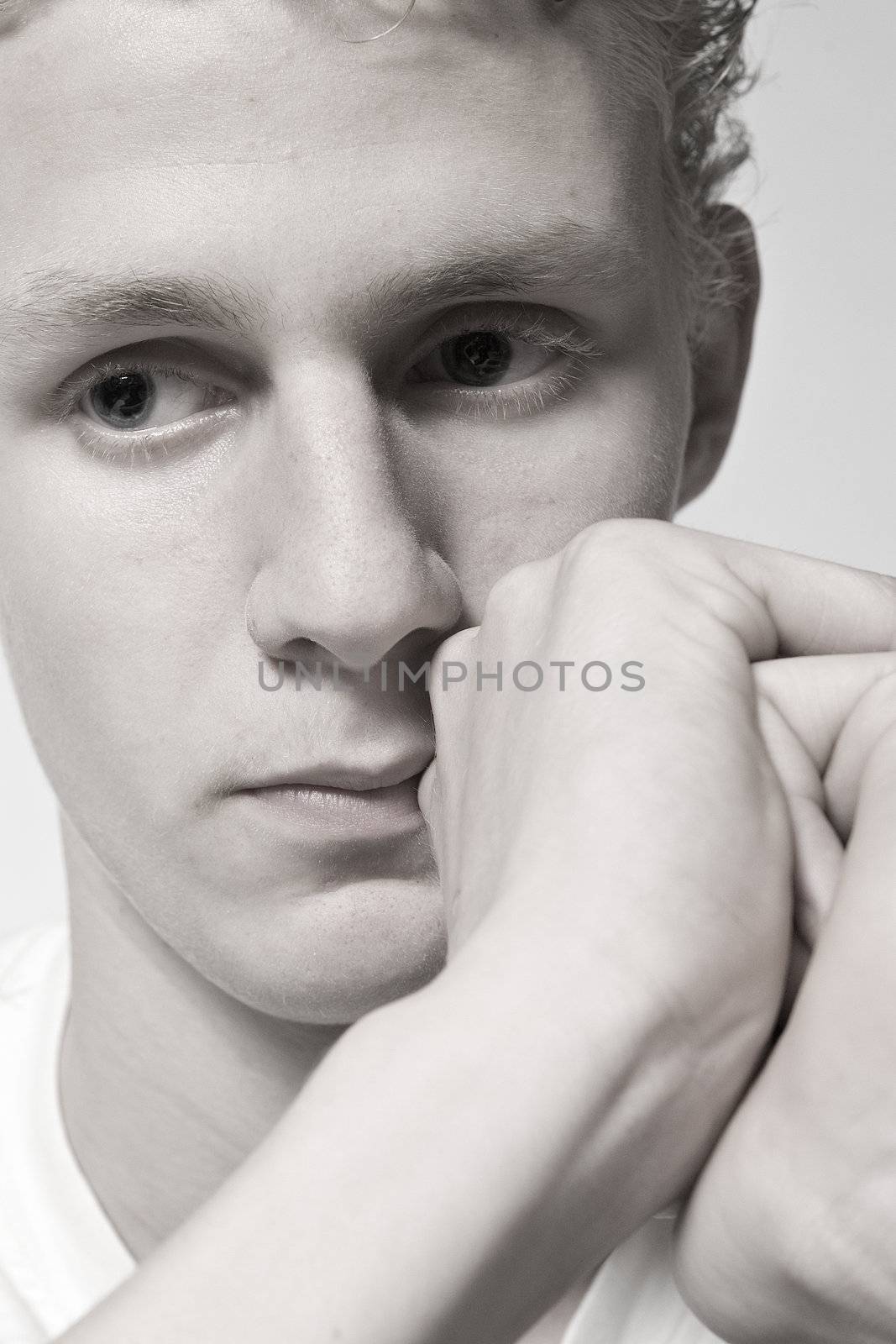 Portrait of a young man in the studio thinking