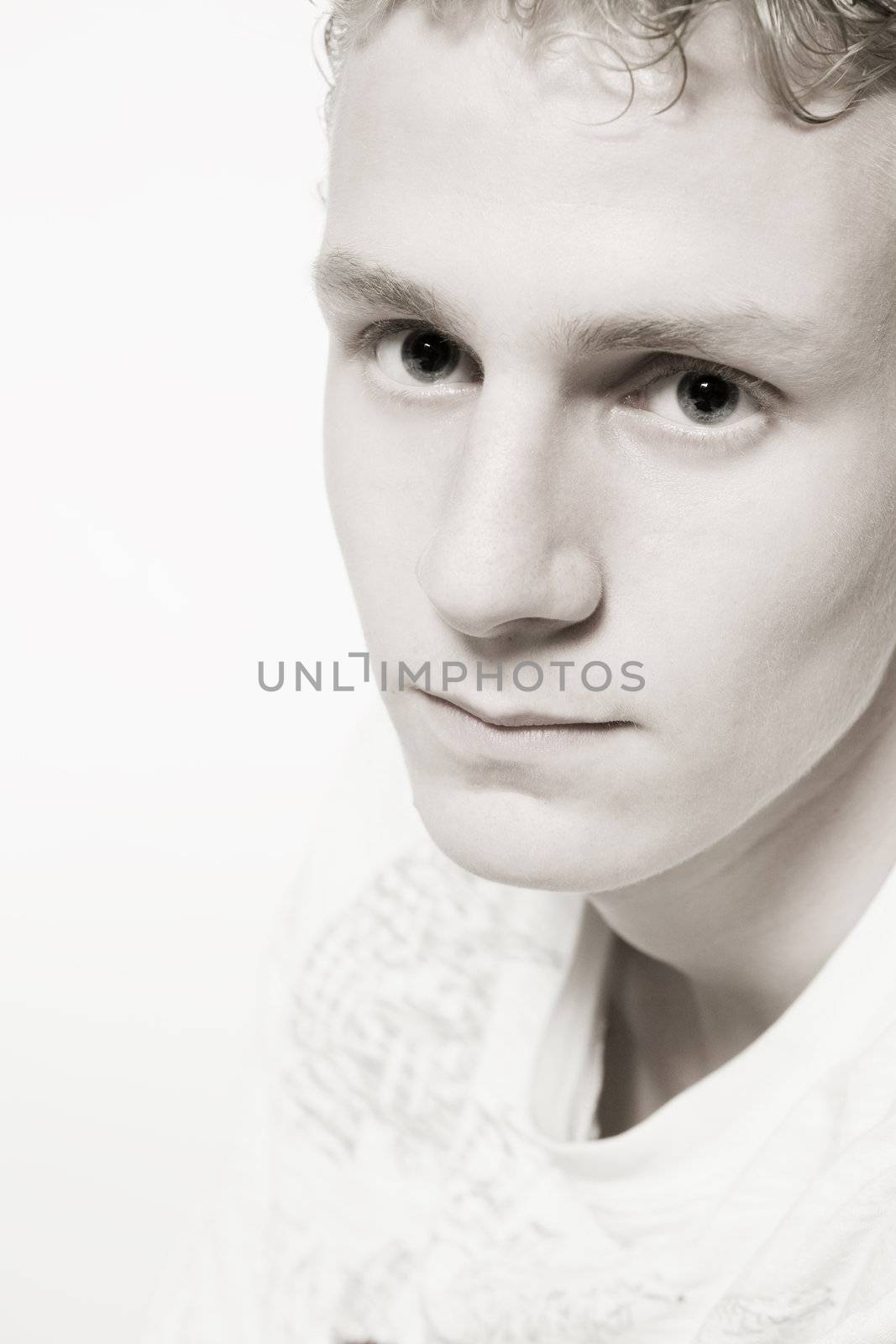 Portrait of a young man in the studio looking aside