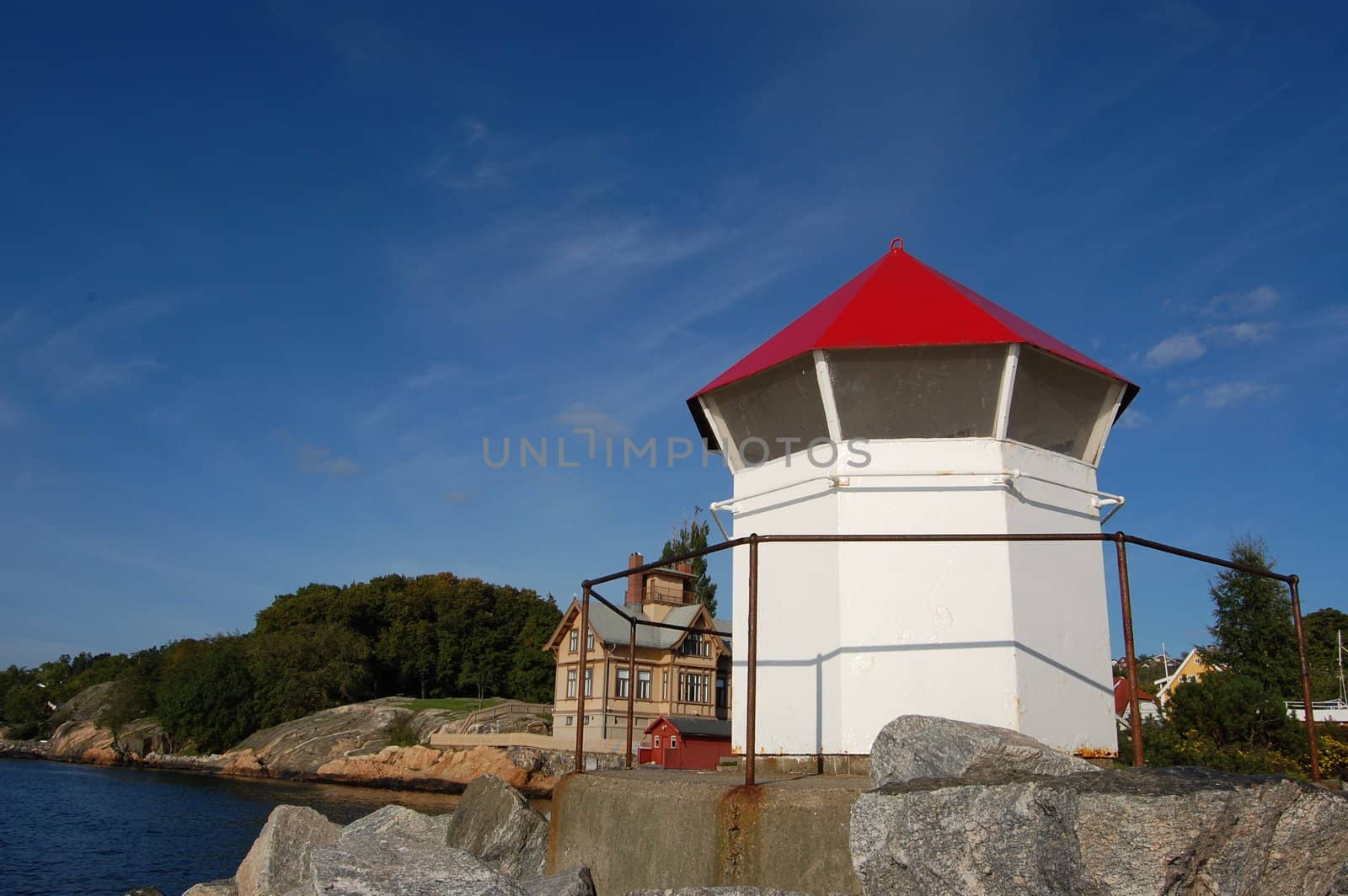 Smal lighthouse at harbor entrance. Droebak Norway