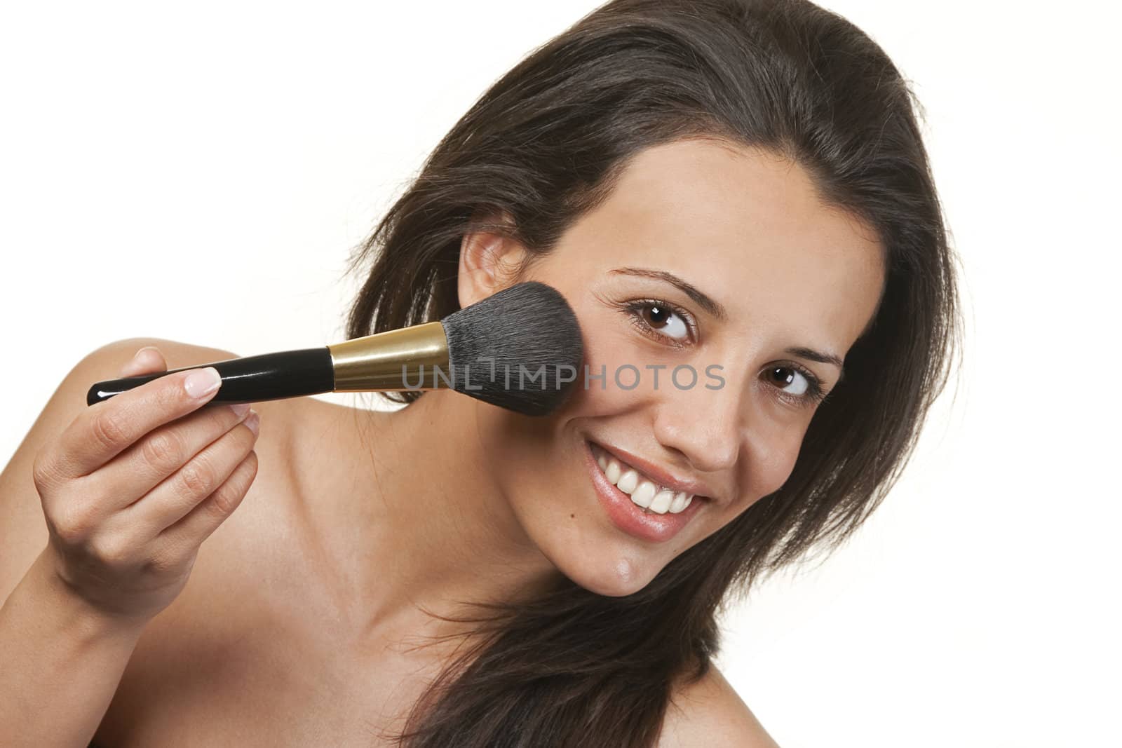 Beauty makeup Caucasian woman smiling closeup. Beautiful young woman applying foundation powder or blush with makeup brush  Isolated on white background