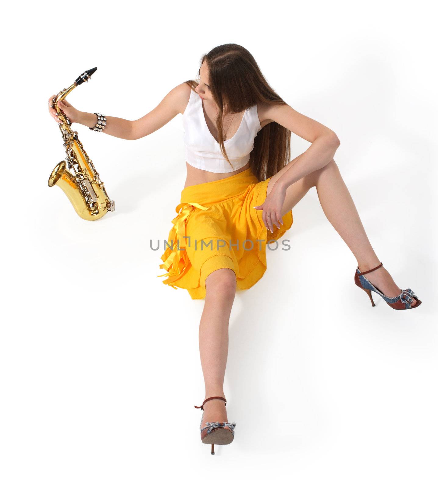 Women's long sitting with sax on tne white background
