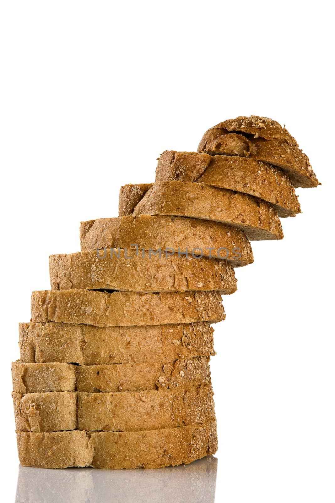 tower of sliced brown bread, isolated on white background