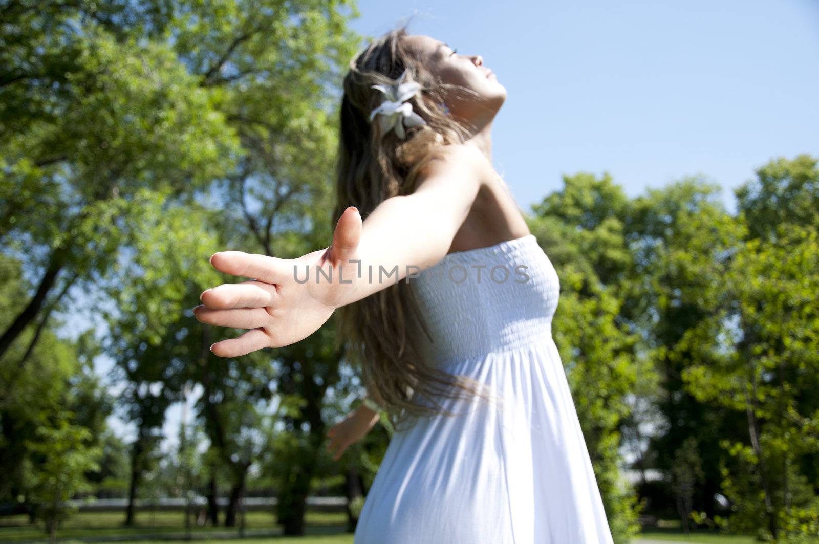 Portrait of the young woman in park