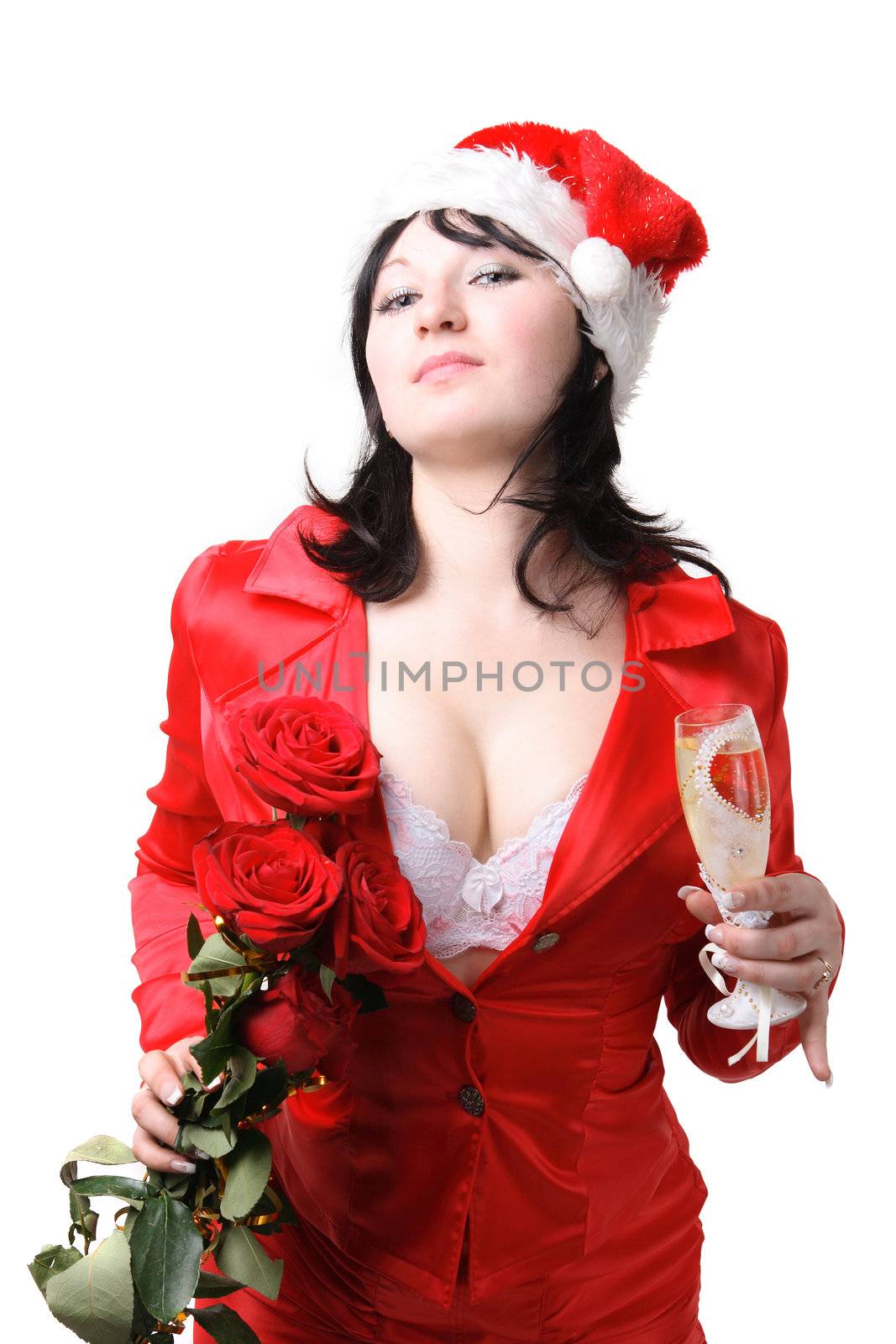 Portrait of a beautiful young woman in a red suit and hat of Santa Claus with red roses and champagne on the white background
