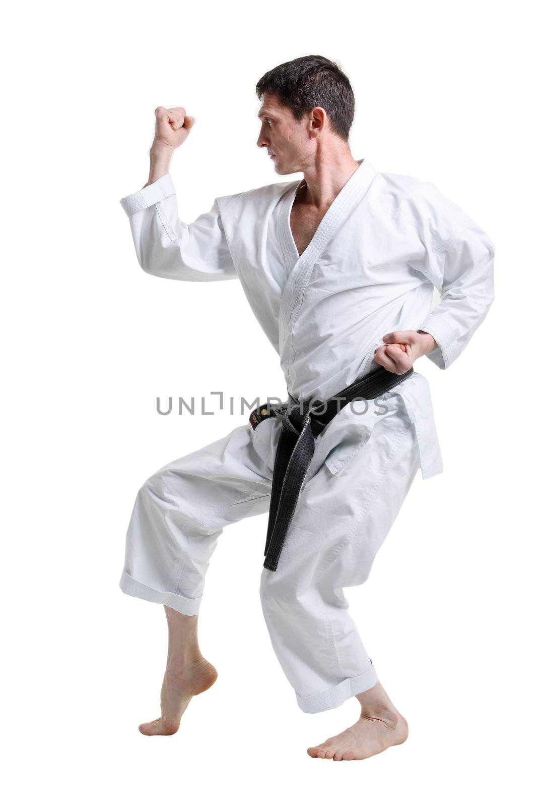 Karate. Man in a kimono with a white background
