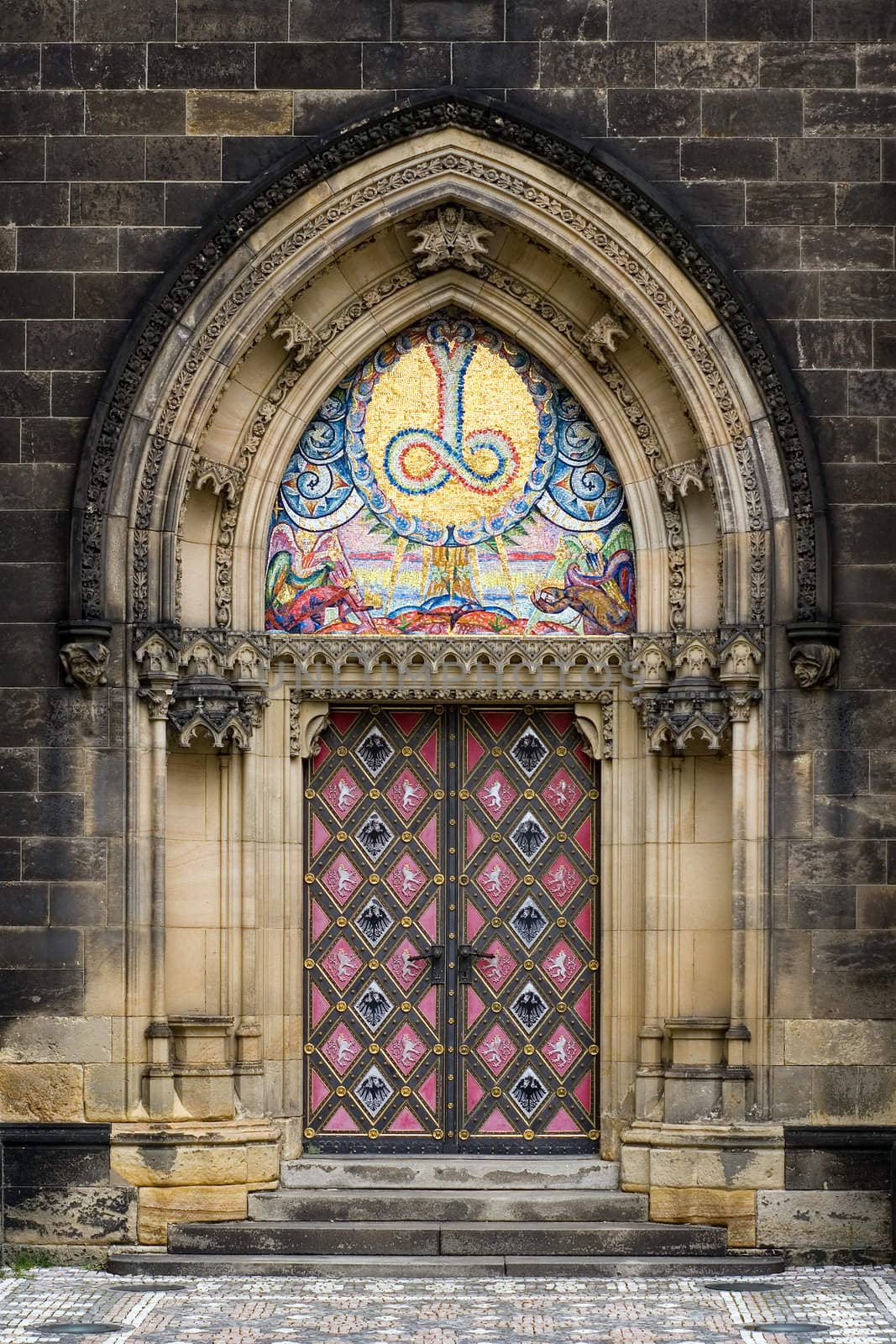 Ornate entrance door in church at Prague