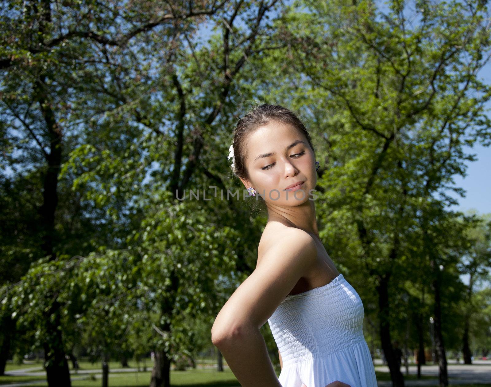 Portrait of the young woman in park