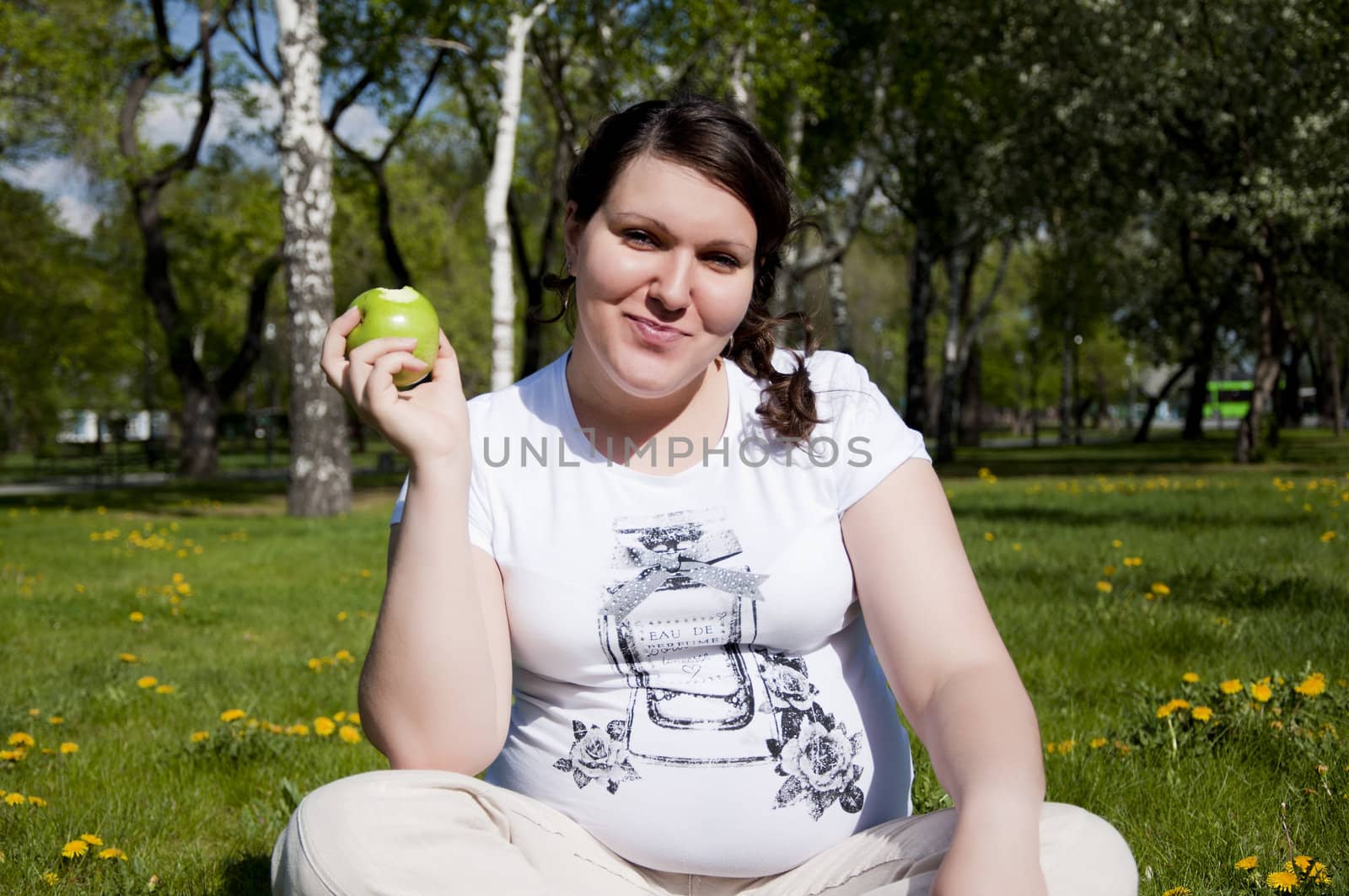 woman sitting on the grass