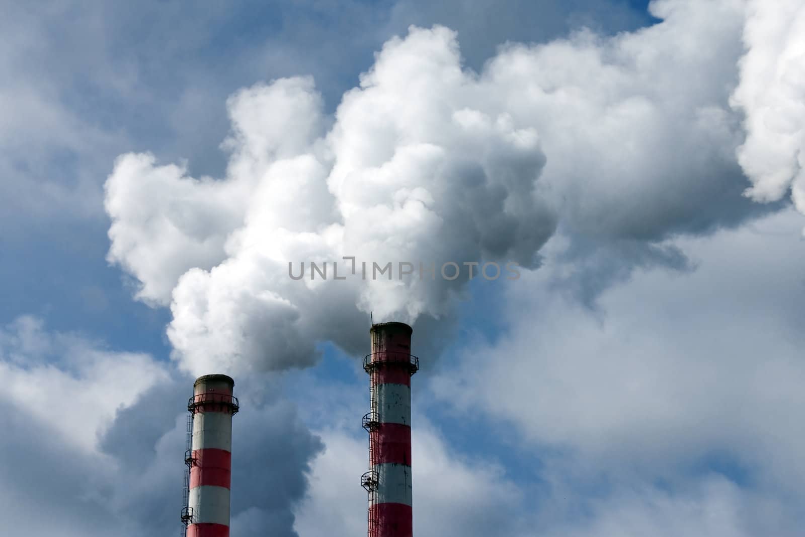 Smoke coming out of an industrial pipes