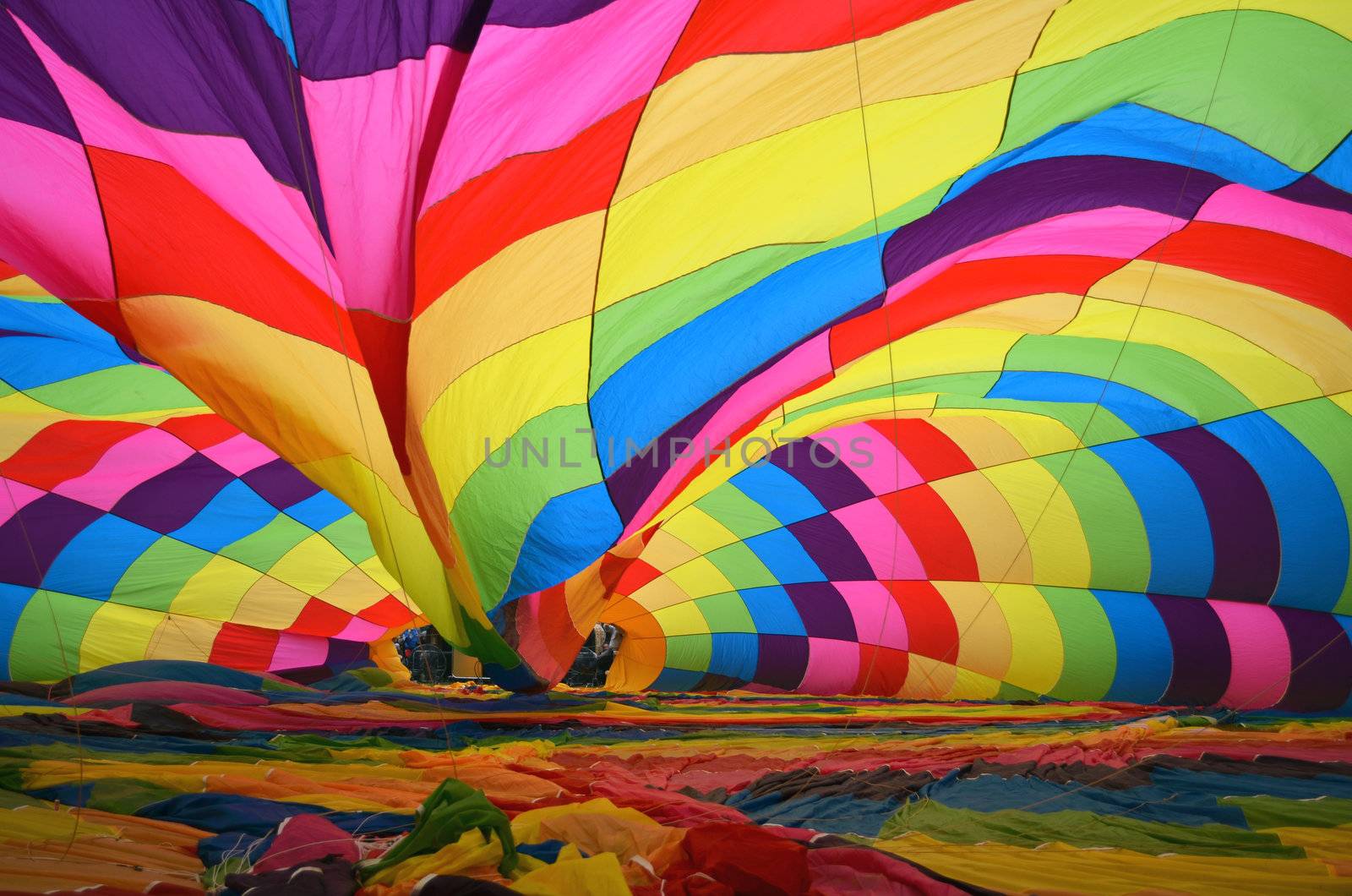 Hot air ballon being inflated on the ground