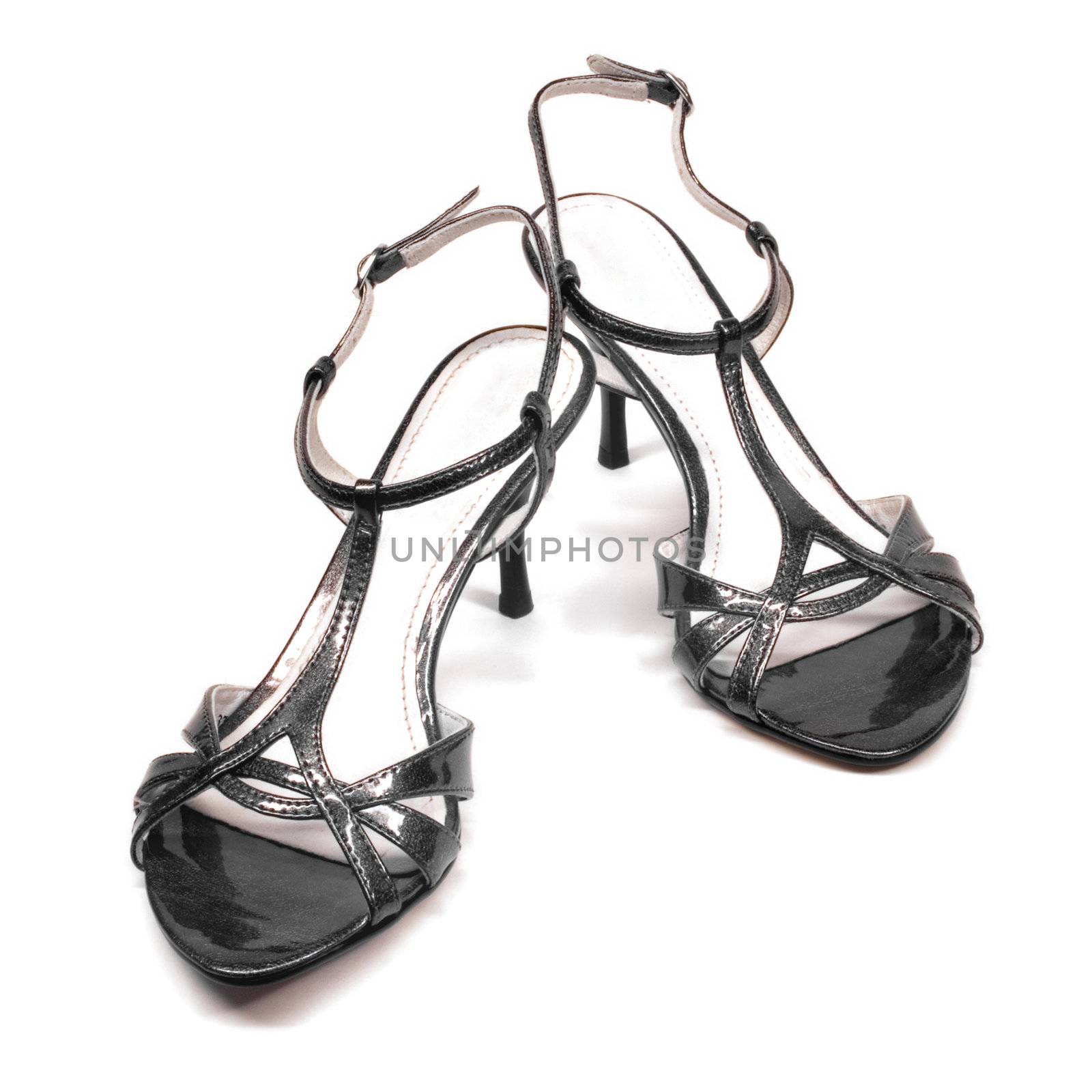 Stylish high heels sandals on white background with smooth shadows