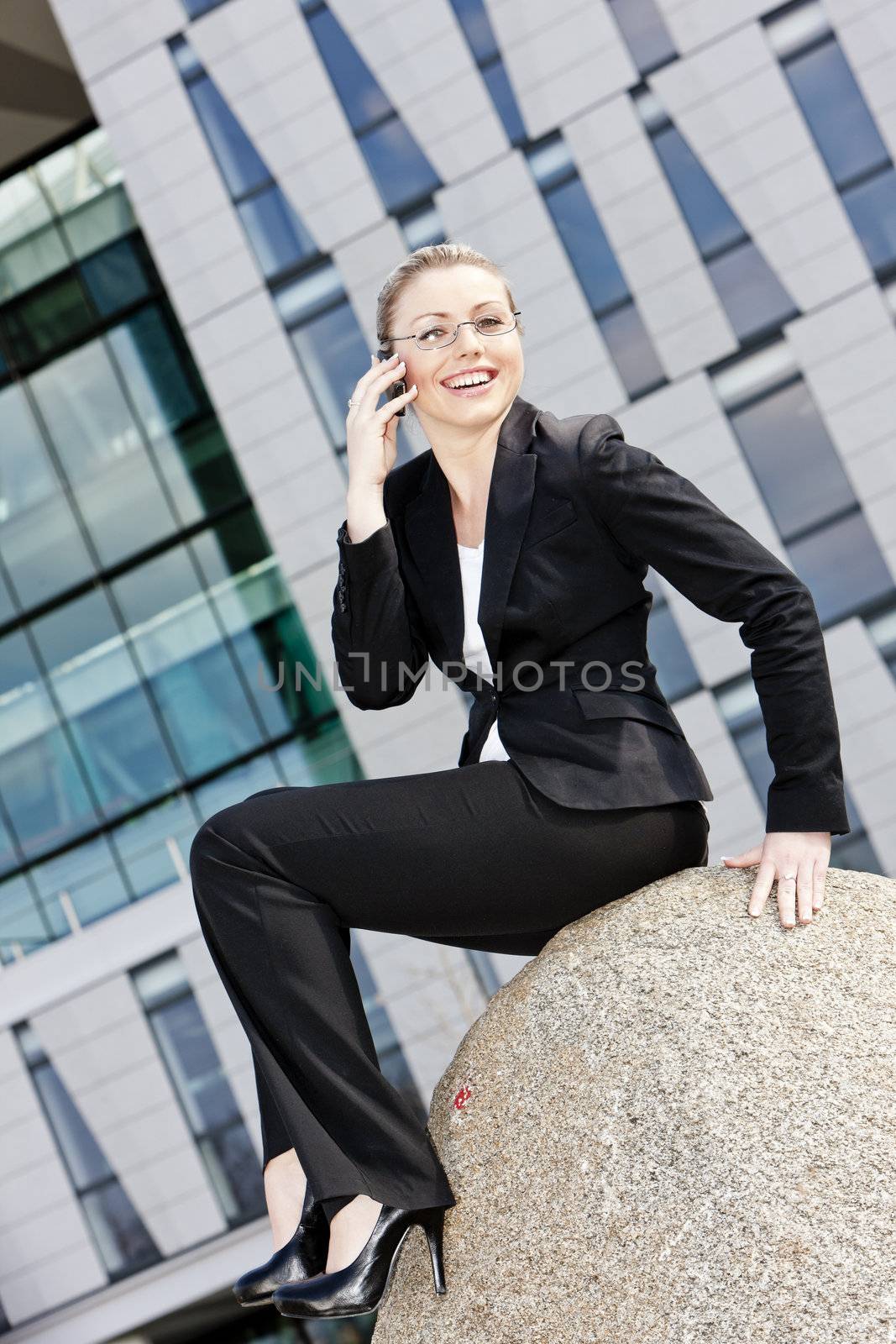 telephoning young businesswoman