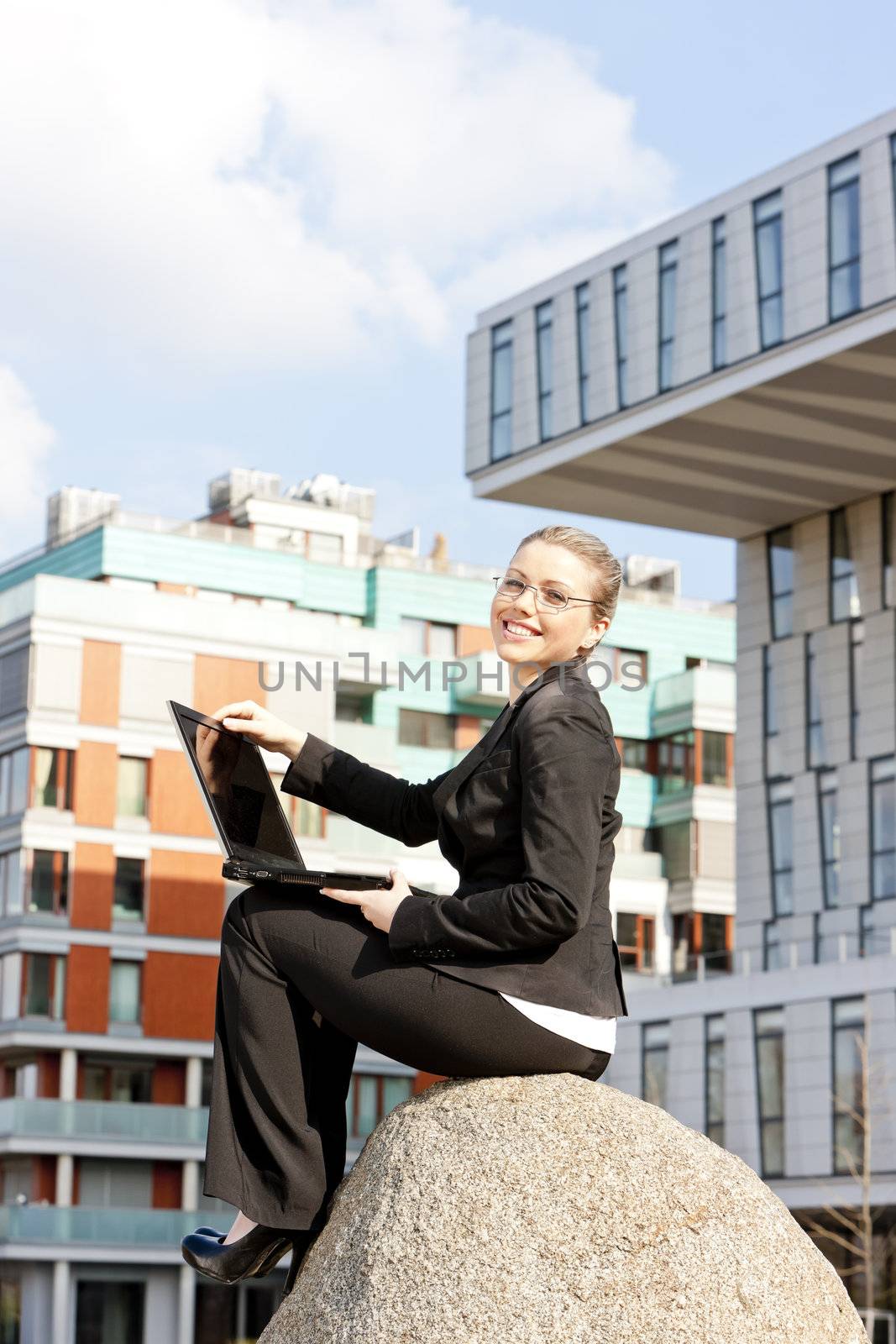 sitting young businesswoman with a notebook