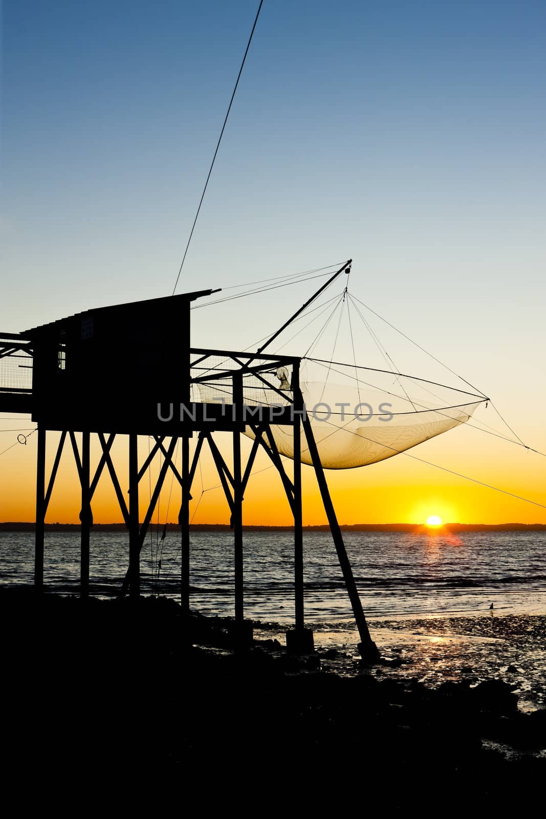 pier with fishing net during sunrise, Gironde Department, Aquitaine, France