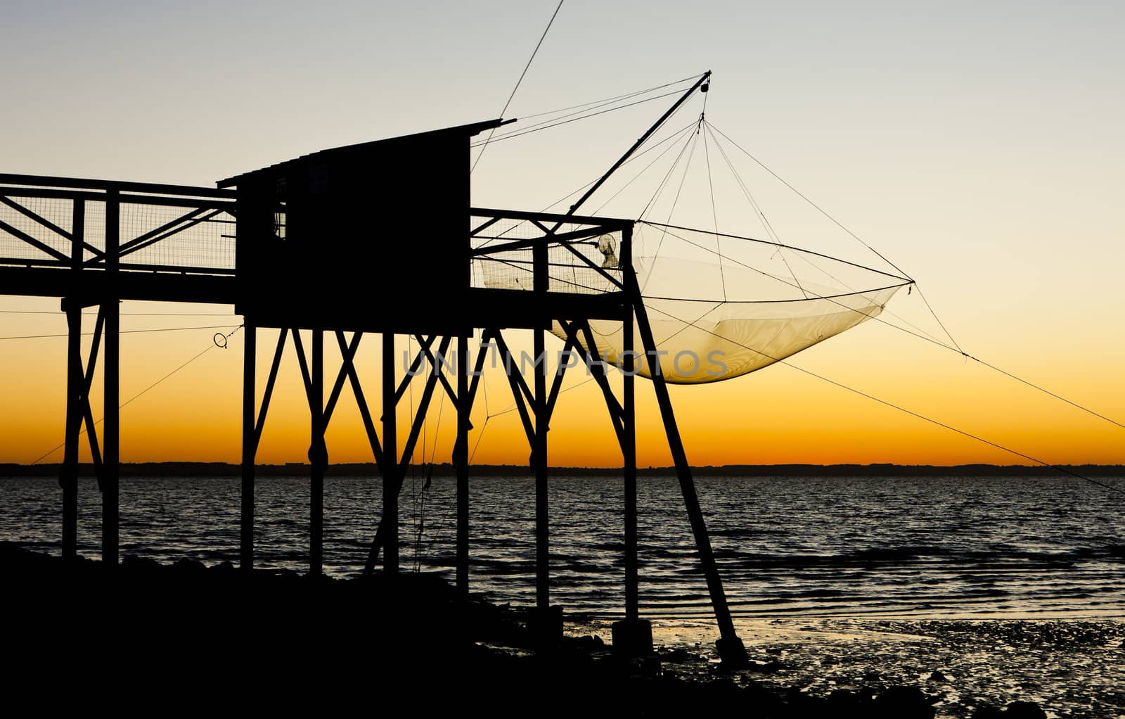 pier with fishing net during sunrise, Gironde Department, Aquitaine, France