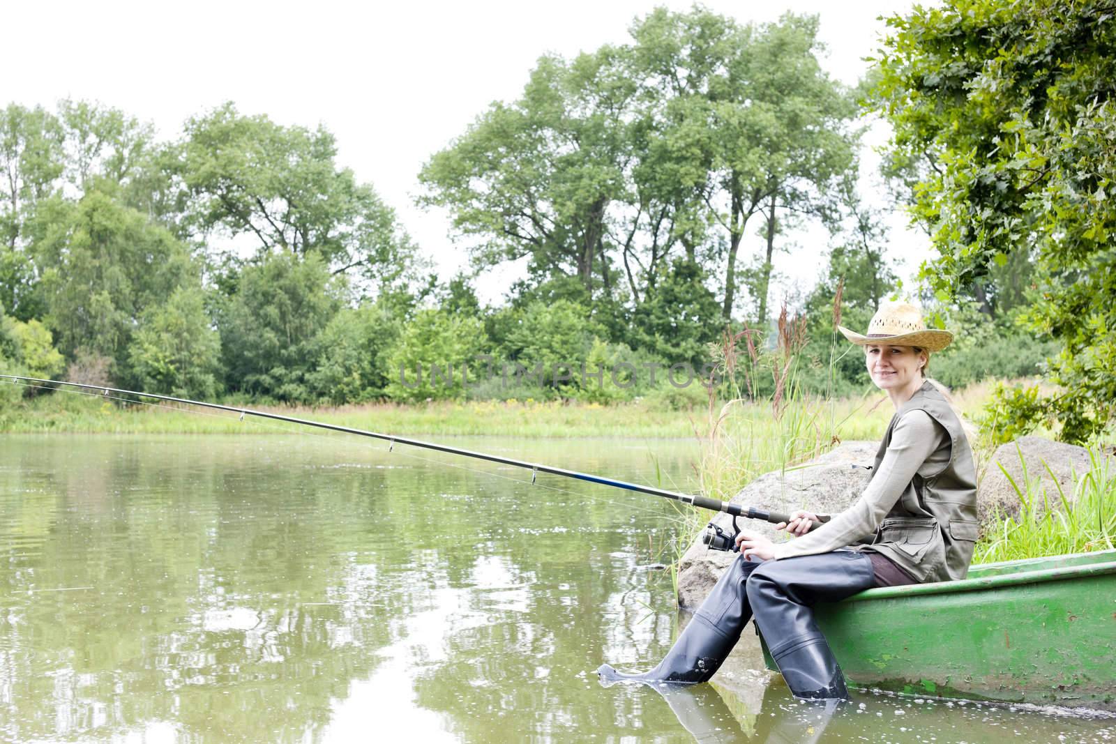 fishing woman sitting on boat