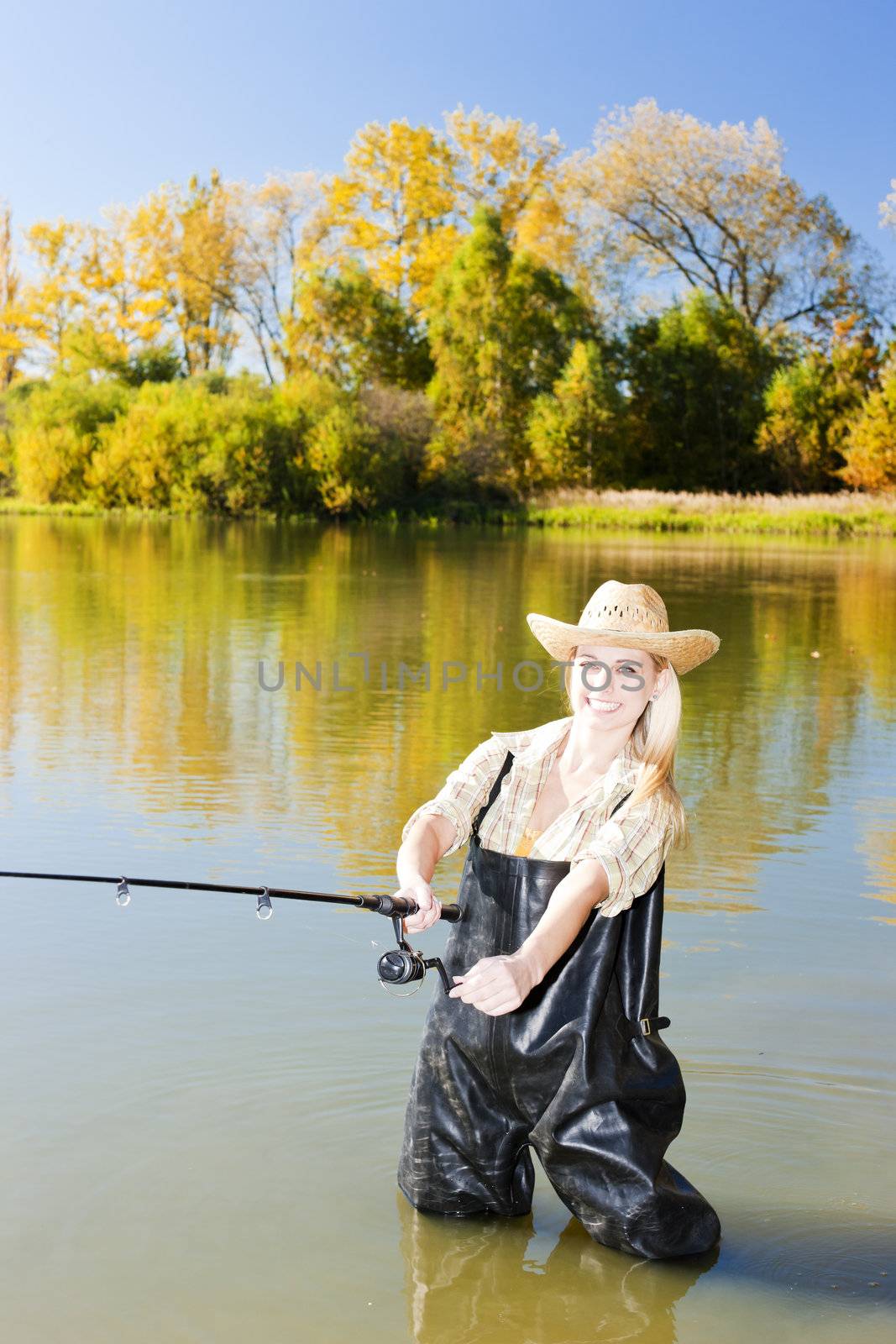 woman fishing in pond