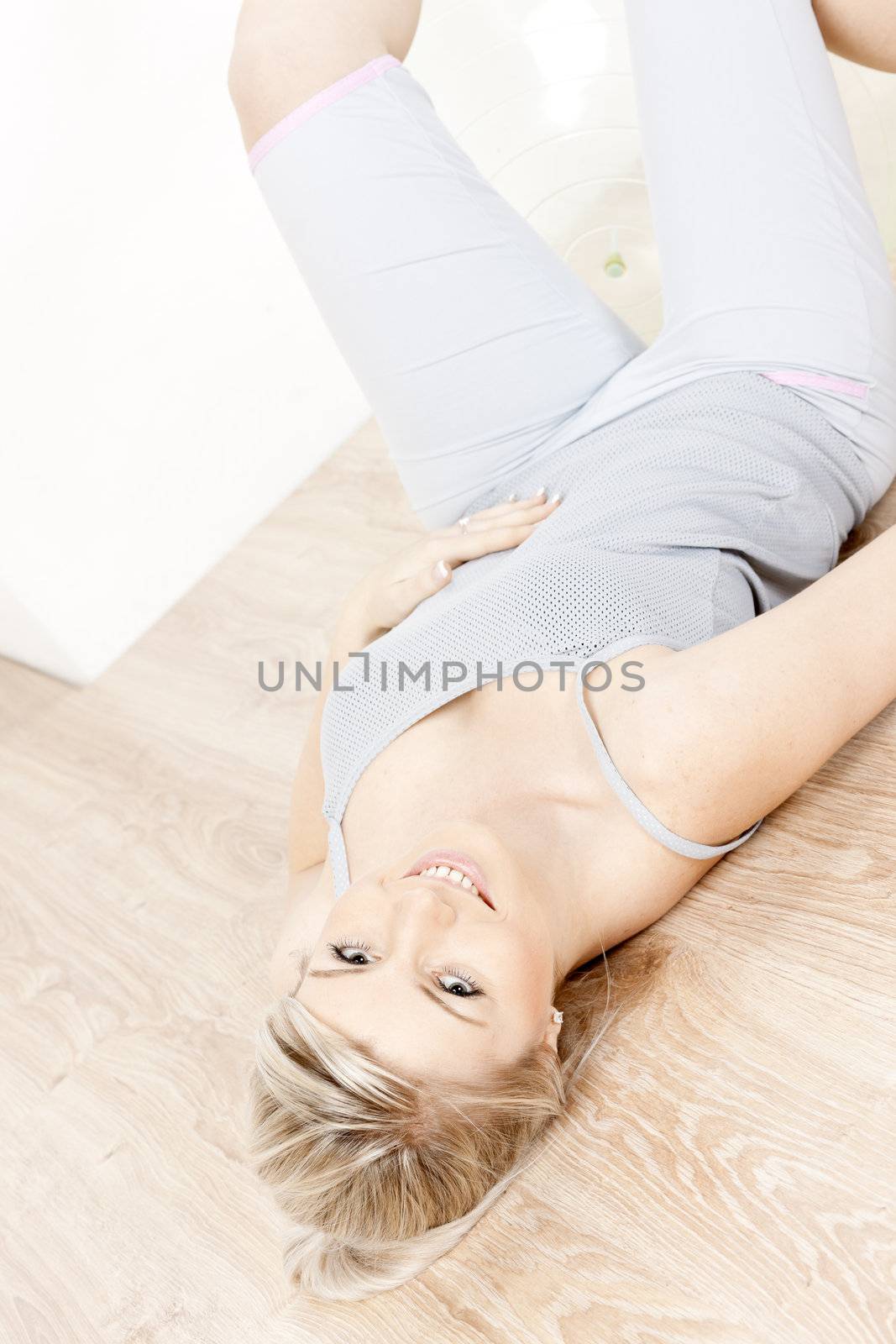 portrait of young woman doing excercises by phbcz