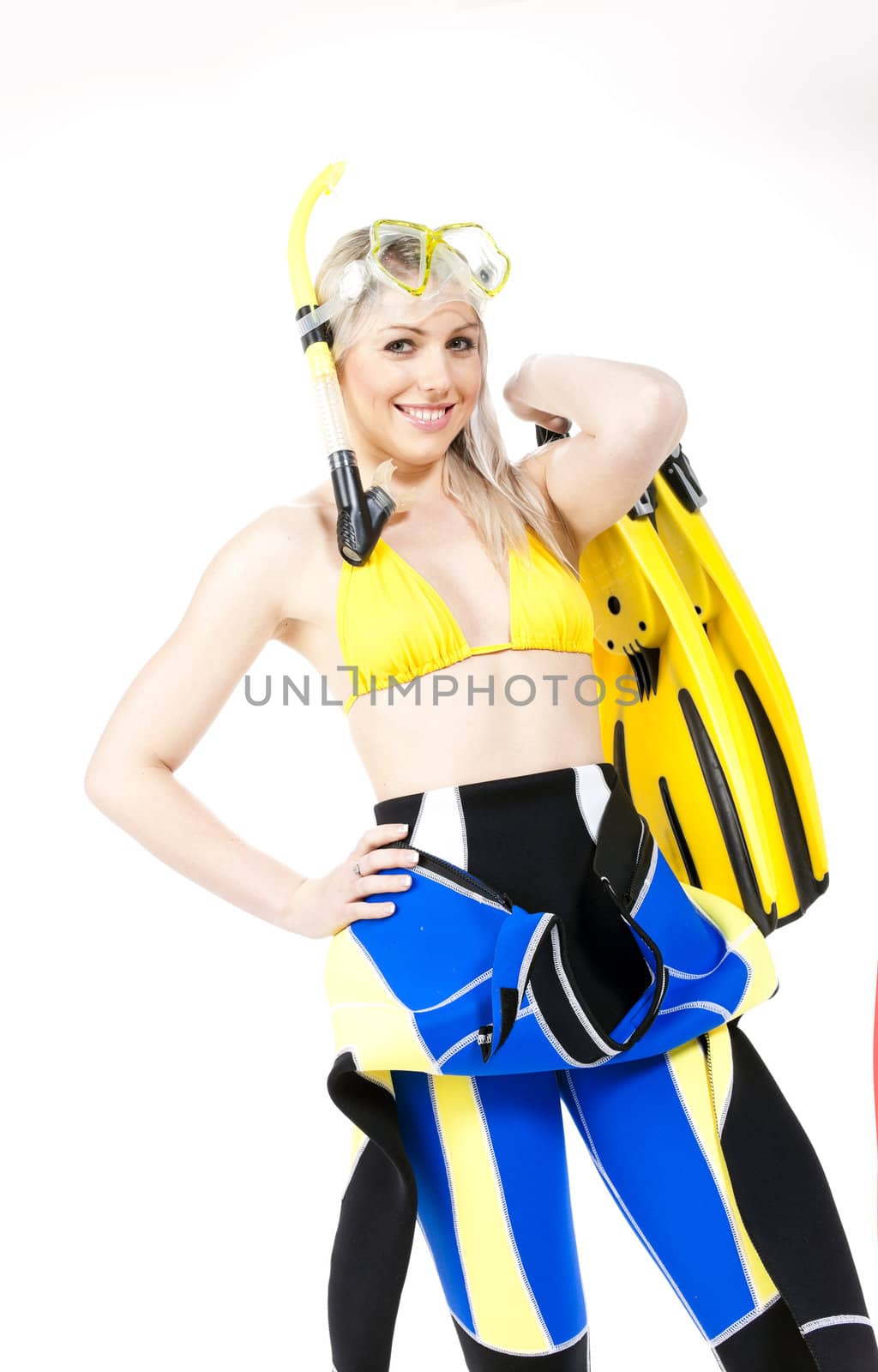 portrait of young woman wearing neoprene with snorkeling equipme by phbcz