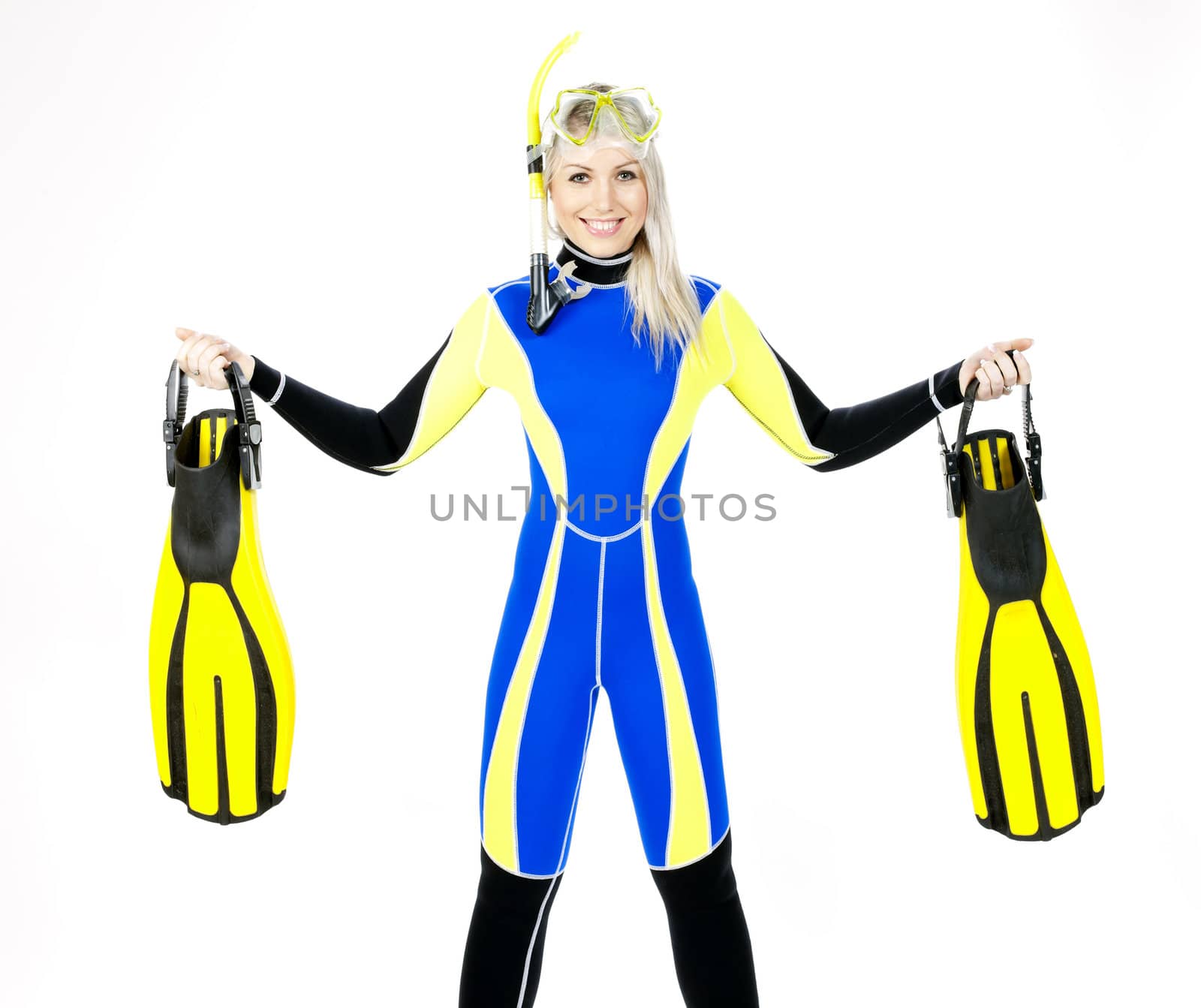 standing young woman wearing neoprene with snorkeling equipment