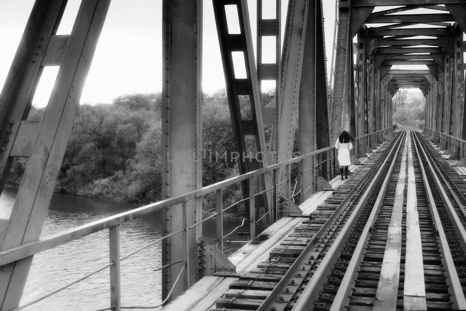 Woman, walking on railway bridge