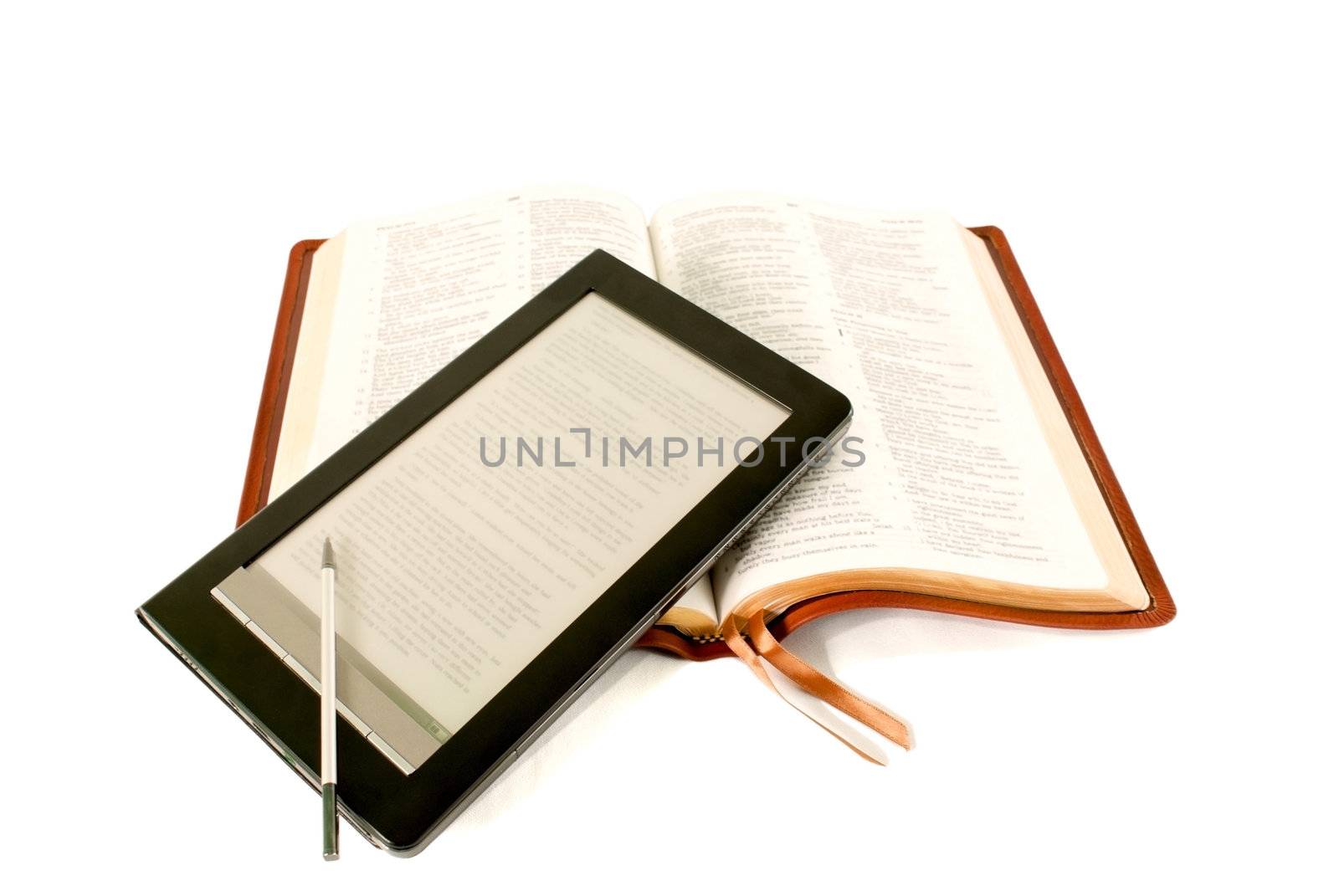 Electronic book reader laying on the Bible