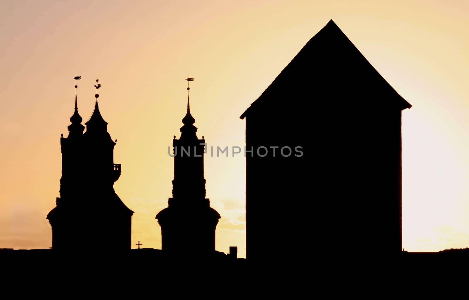Silhouettes of a Church and a huge Tower.
