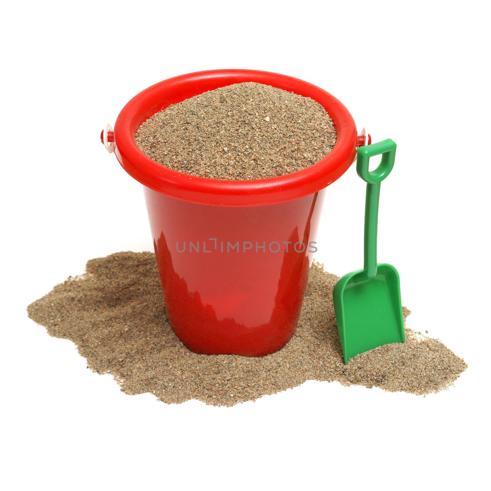 An isolated shot of a bucket of sand for the childrens play time either on vacation, at the beach, or just at home in the sandbox.