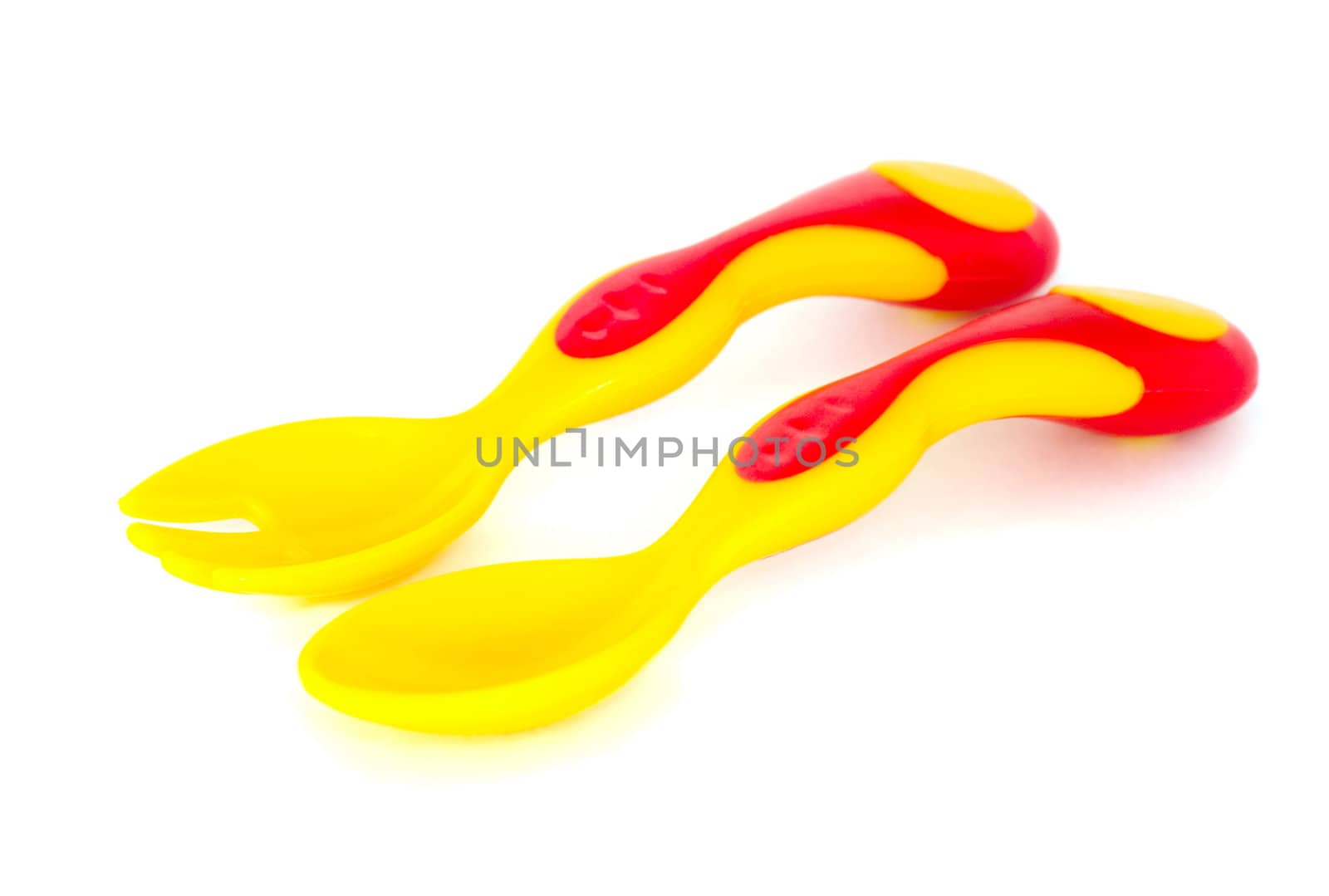 Colorful baby spoon and fork,  isolated