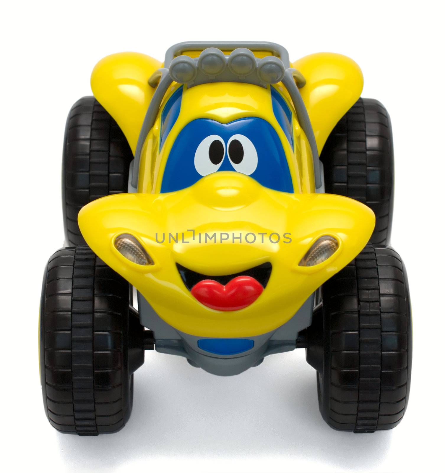 Top view of funny yellow toy truck, isolated