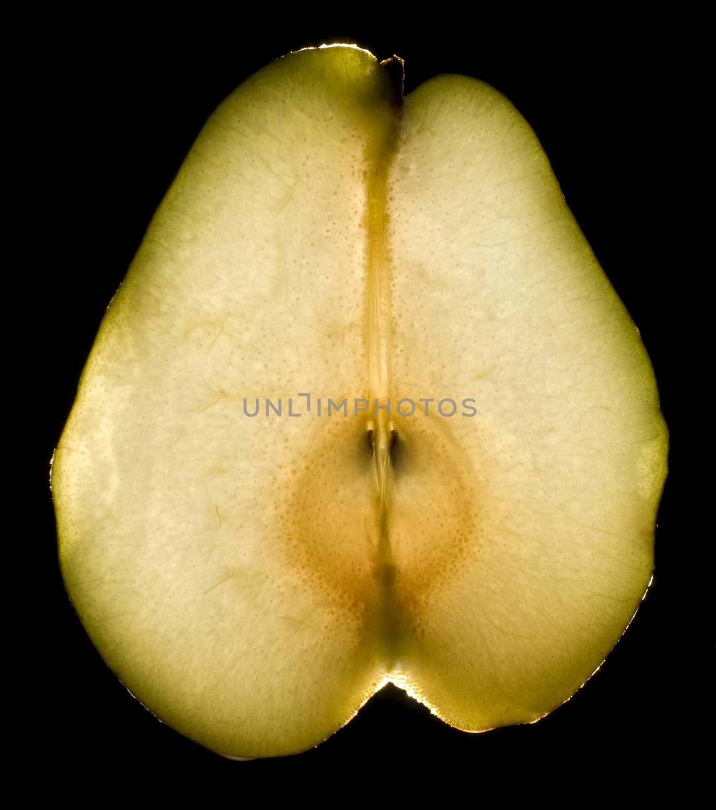 juicy luminous pear on black background